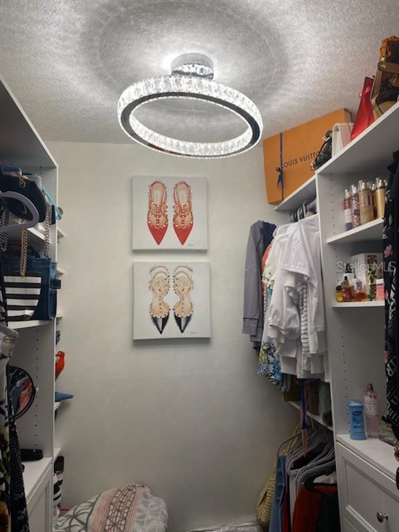 8350 Sands Point Boulevard, Unit 205E Fort Lauderdale, FL 33321 - Photo 15 of 16 a bathroom with a refrigerator and a sink