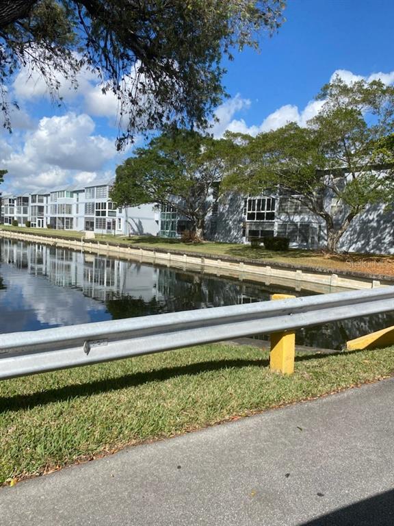 8350 Sands Point Boulevard, Unit 205E Fort Lauderdale, FL 33321 - Photo 2 of 16 a view of a swimming pool with an outdoor seating