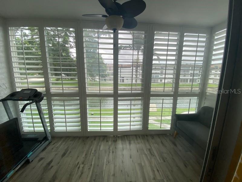 8350 Sands Point Boulevard, Unit 205E Fort Lauderdale, FL 33321 - Photo 10 of 16 a view of wooden floor and windows in a room