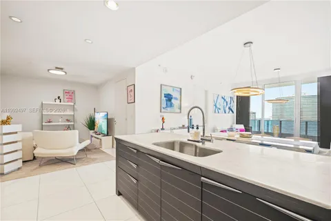 a kitchen with sink cabinets and outdoor view