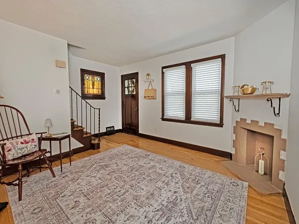 a view of a livingroom with furniture and a window