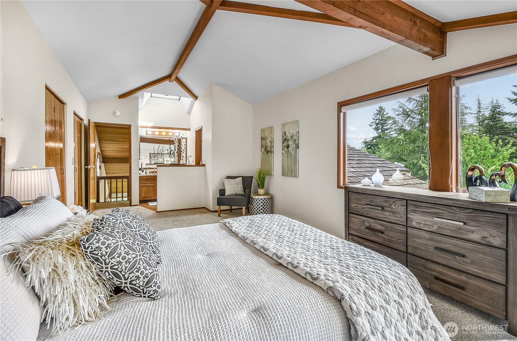 16901 Southeast 45th Street Bellevue, WA 98006 - Photo 23 of 29 a bedroom with a large bed and a large window