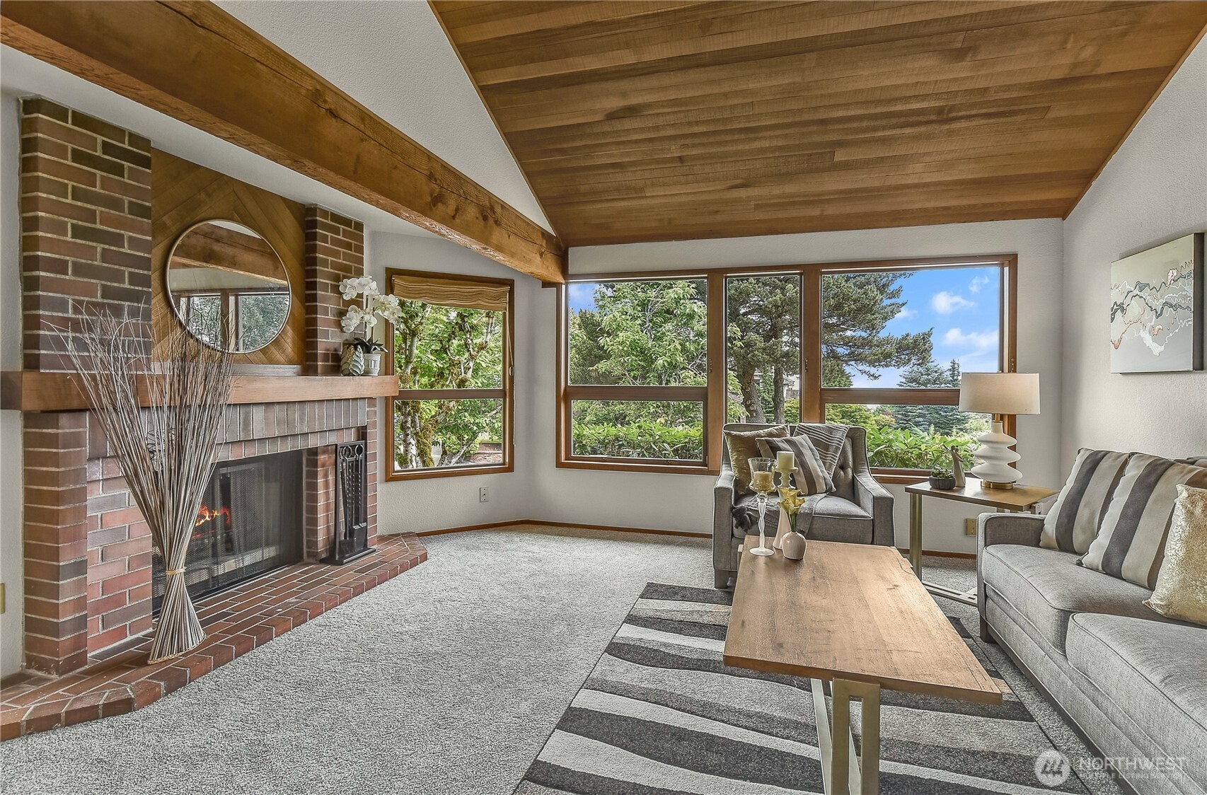 16901 Southeast 45th Street Bellevue, WA 98006 - Photo 4 of 29 a living room with furniture a fireplace and a large window