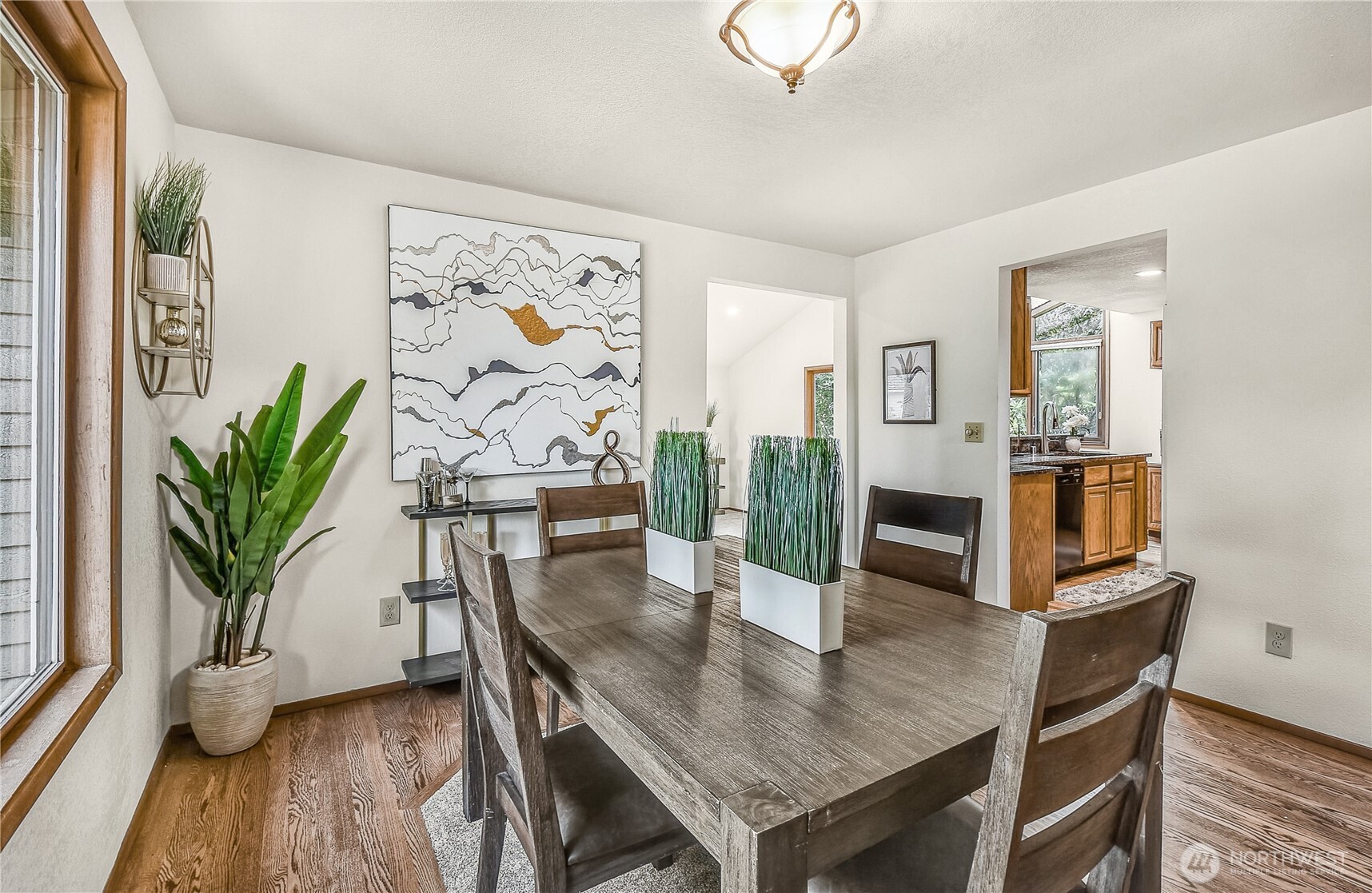 16901 Southeast 45th Street Bellevue, WA 98006 - Photo 8 of 29 a view of a dining room with furniture and wooden floor