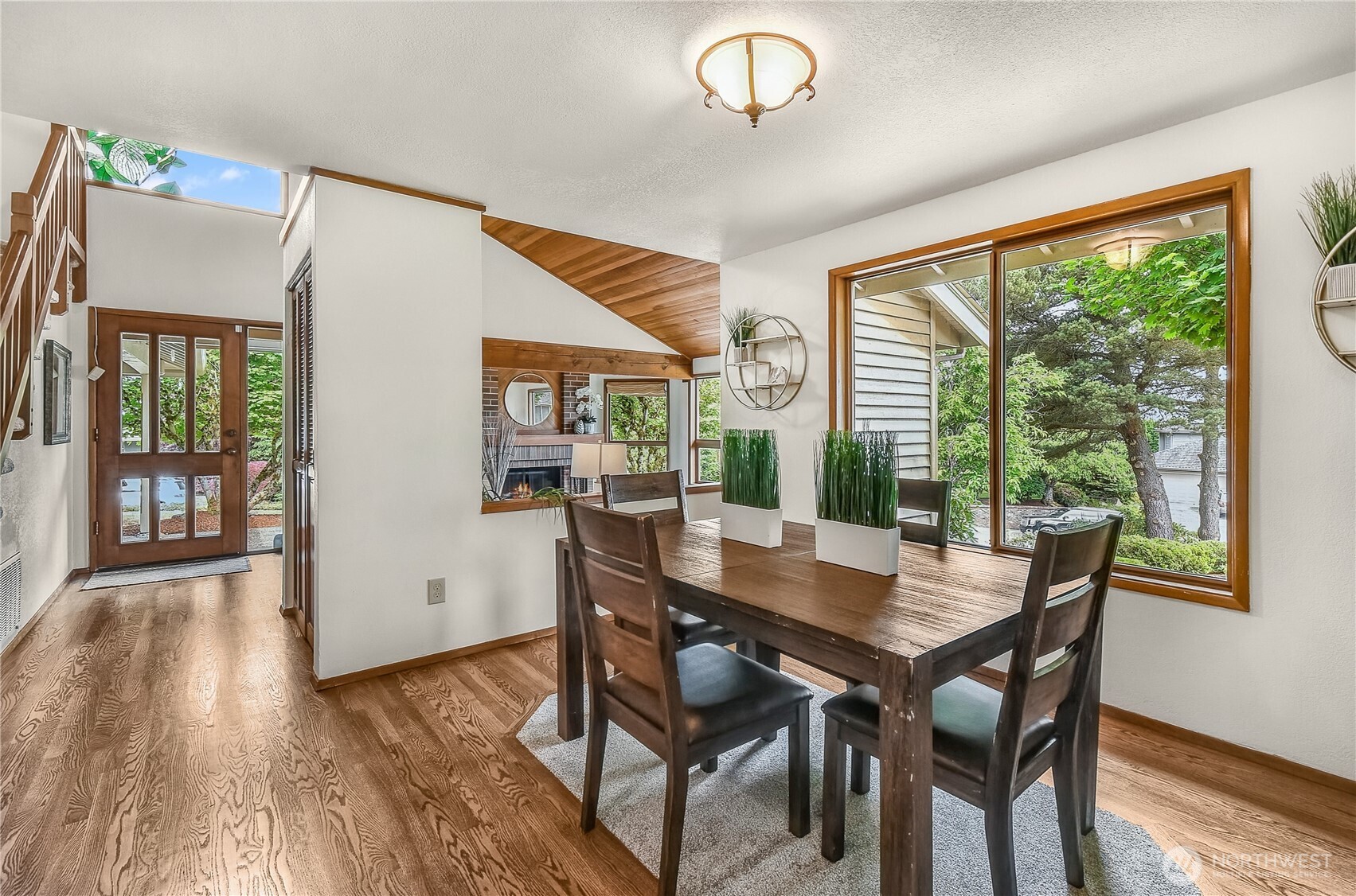 16901 Southeast 45th Street Bellevue, WA 98006 - Photo 9 of 29 a view of a dining room with furniture window and wooden floor