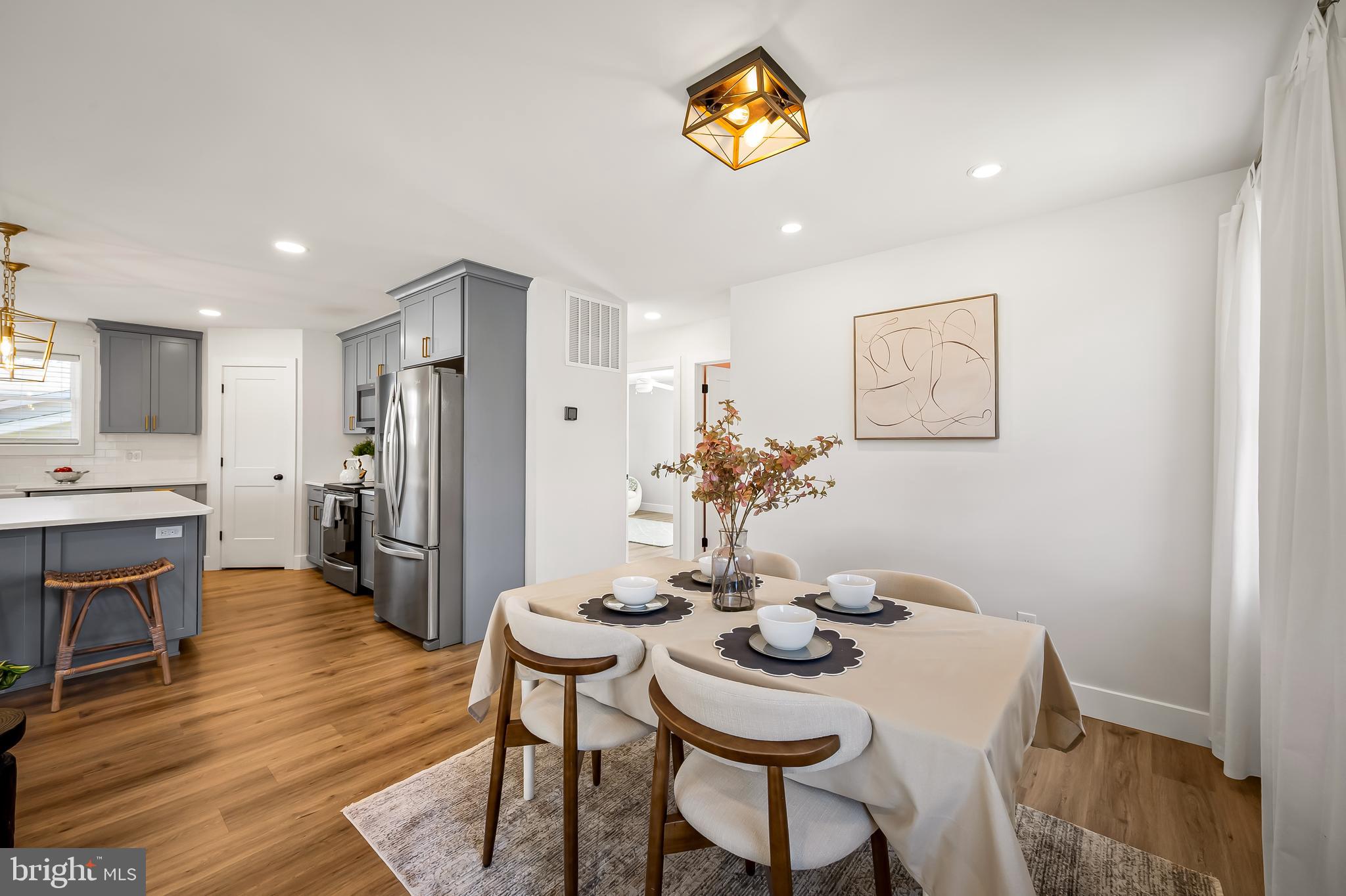 7321 Chesapeake Road Baltimore, MD 21220 - Photo 12 of 60 a view of a dining room with furniture and wooden floor