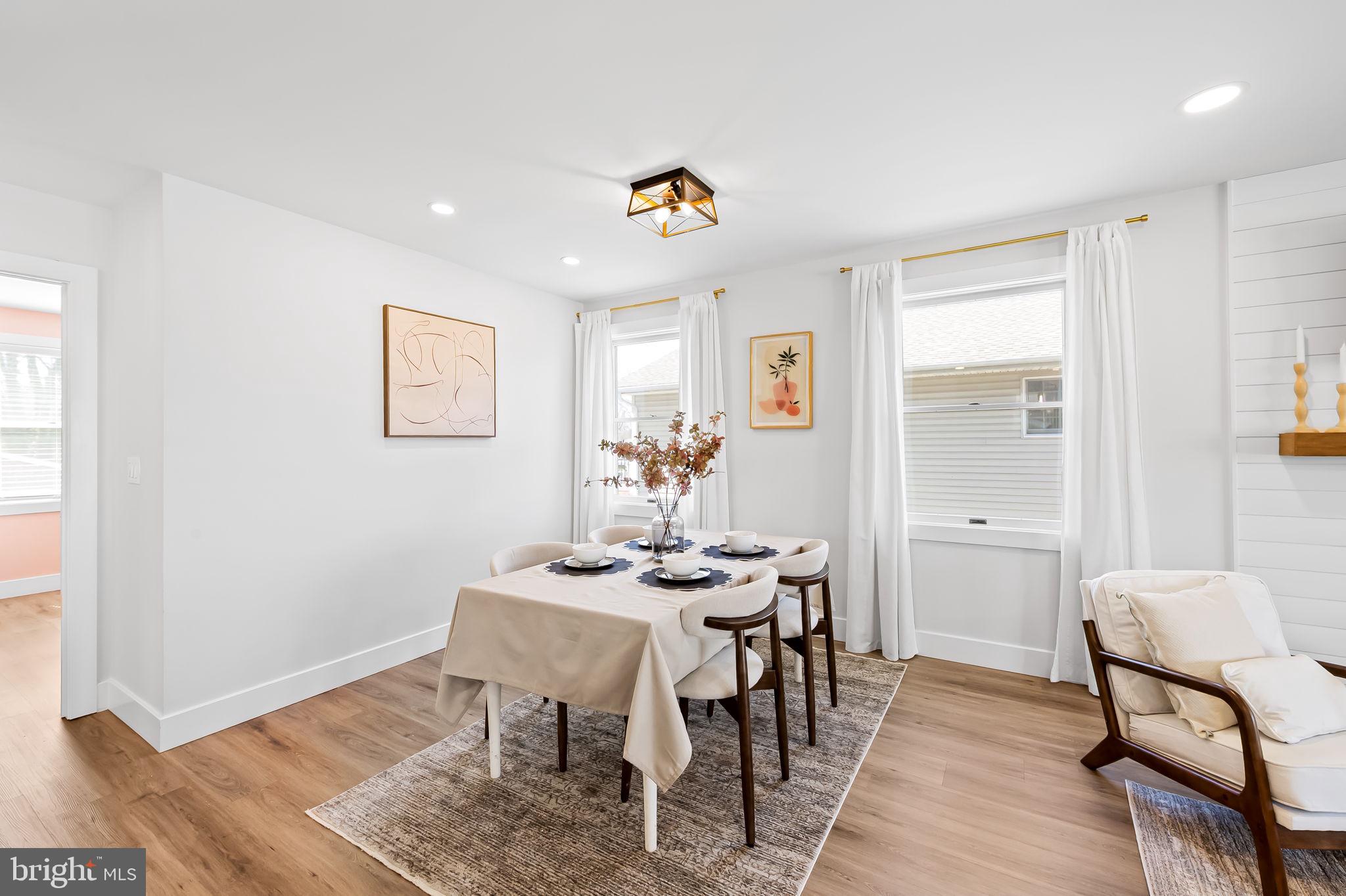 7321 Chesapeake Road Baltimore, MD 21220 - Photo 13 of 60 a view of a dining room with furniture and wooden floor