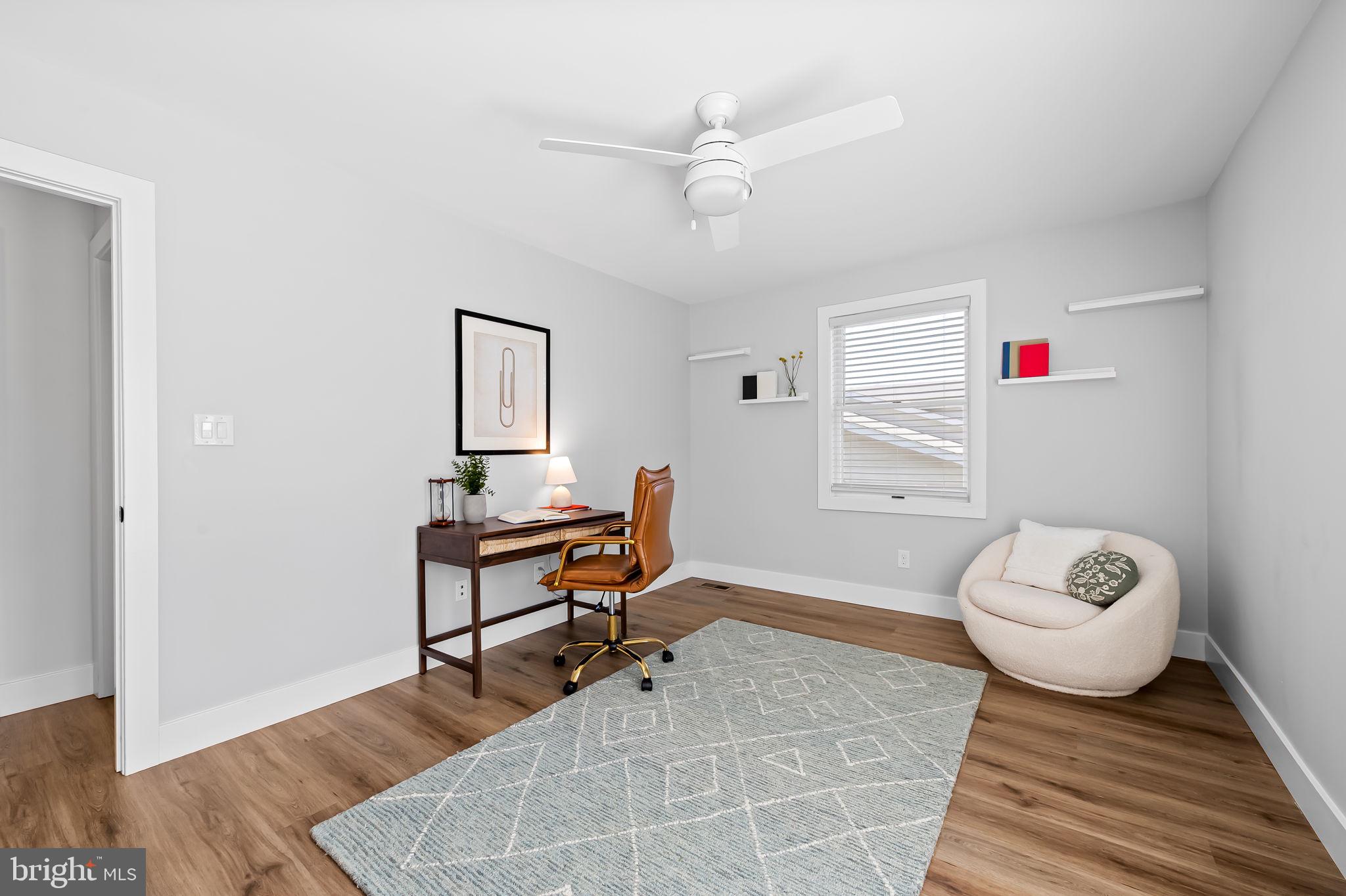 7321 Chesapeake Road Baltimore, MD 21220 - Photo 17 of 60 a living room with furniture and a wooden floor