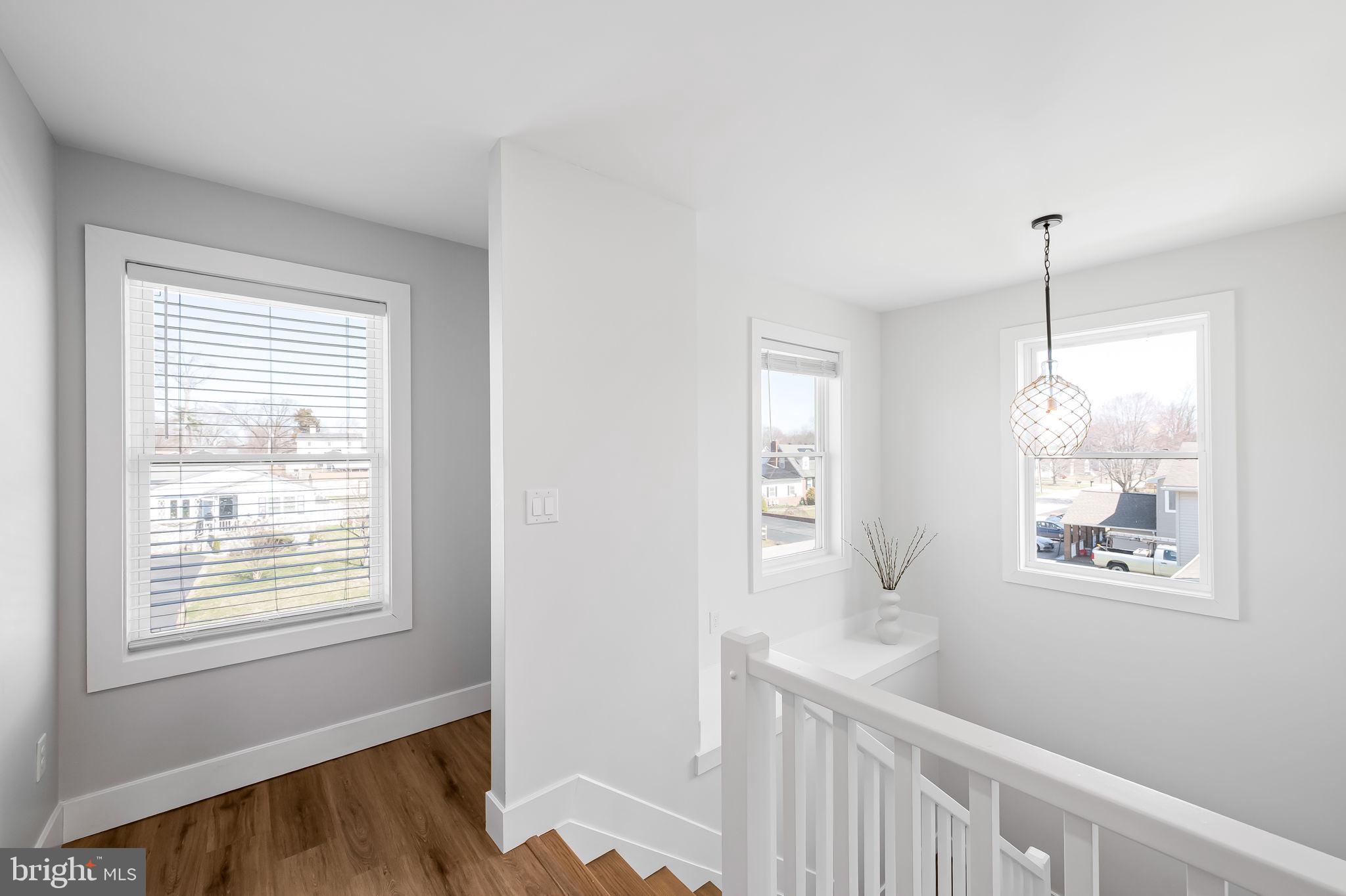 7321 Chesapeake Road Baltimore, MD 21220 - Photo 21 of 60 a view of hallway with window and wooden floor