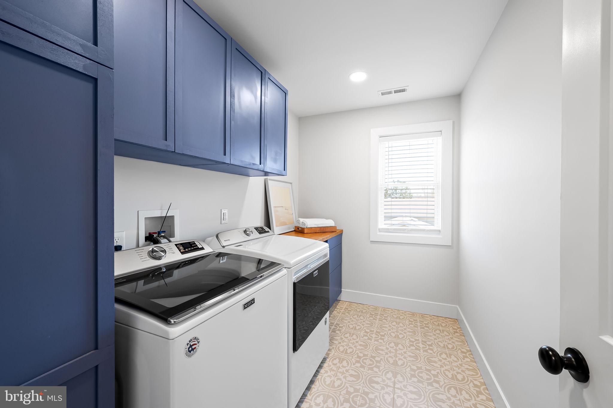 7321 Chesapeake Road Baltimore, MD 21220 - Photo 25 of 60 a utility room with wooden floor washer and dryer