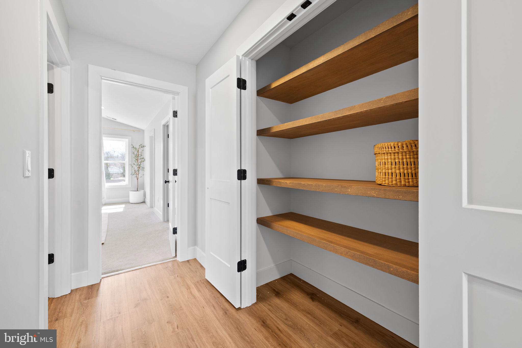 7321 Chesapeake Road Baltimore, MD 21220 - Photo 26 of 60 a view of walk in closet with empty racks