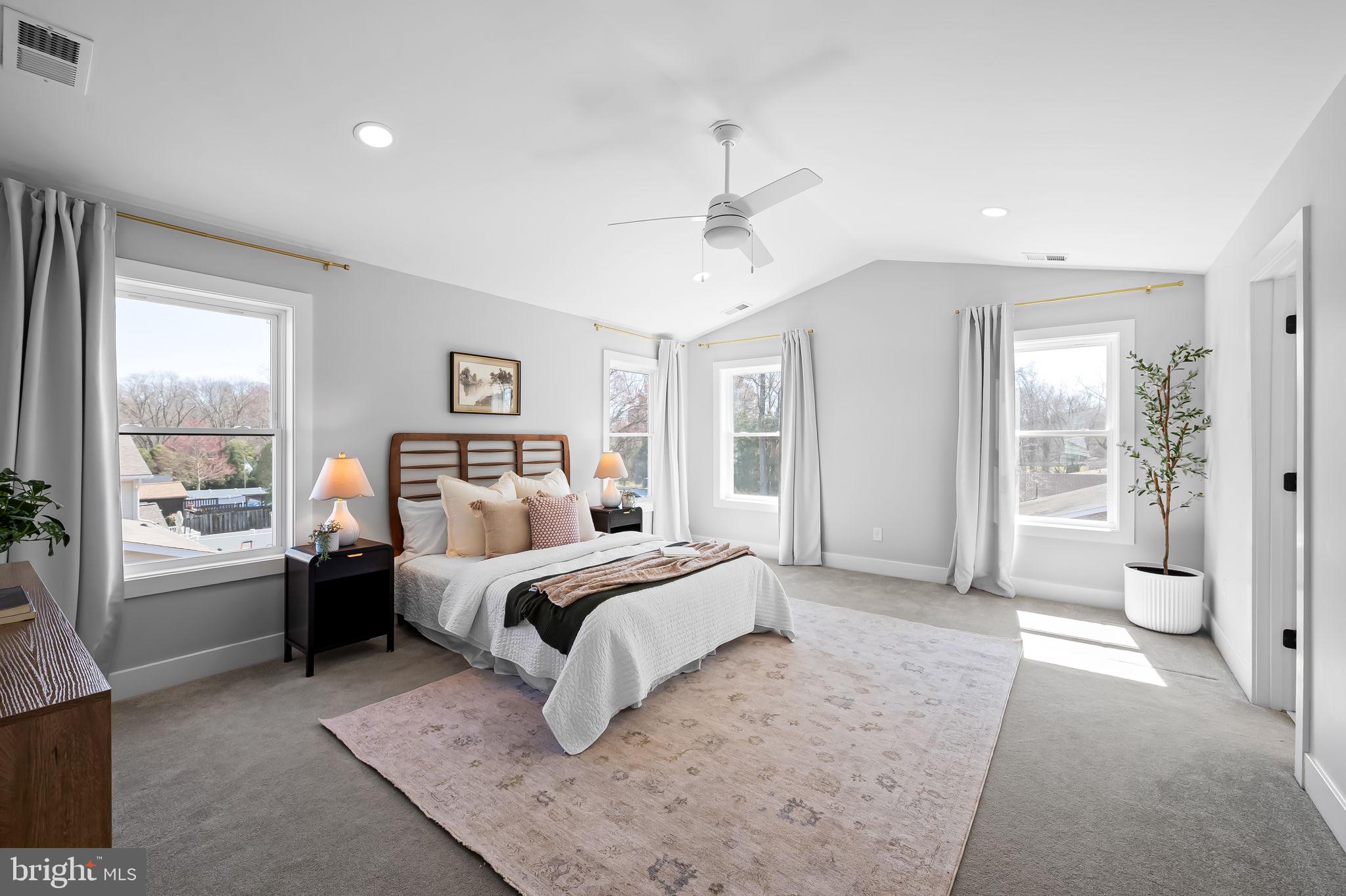 7321 Chesapeake Road Baltimore, MD 21220 - Photo 27 of 60 a bedroom with a large bed and a chandelier