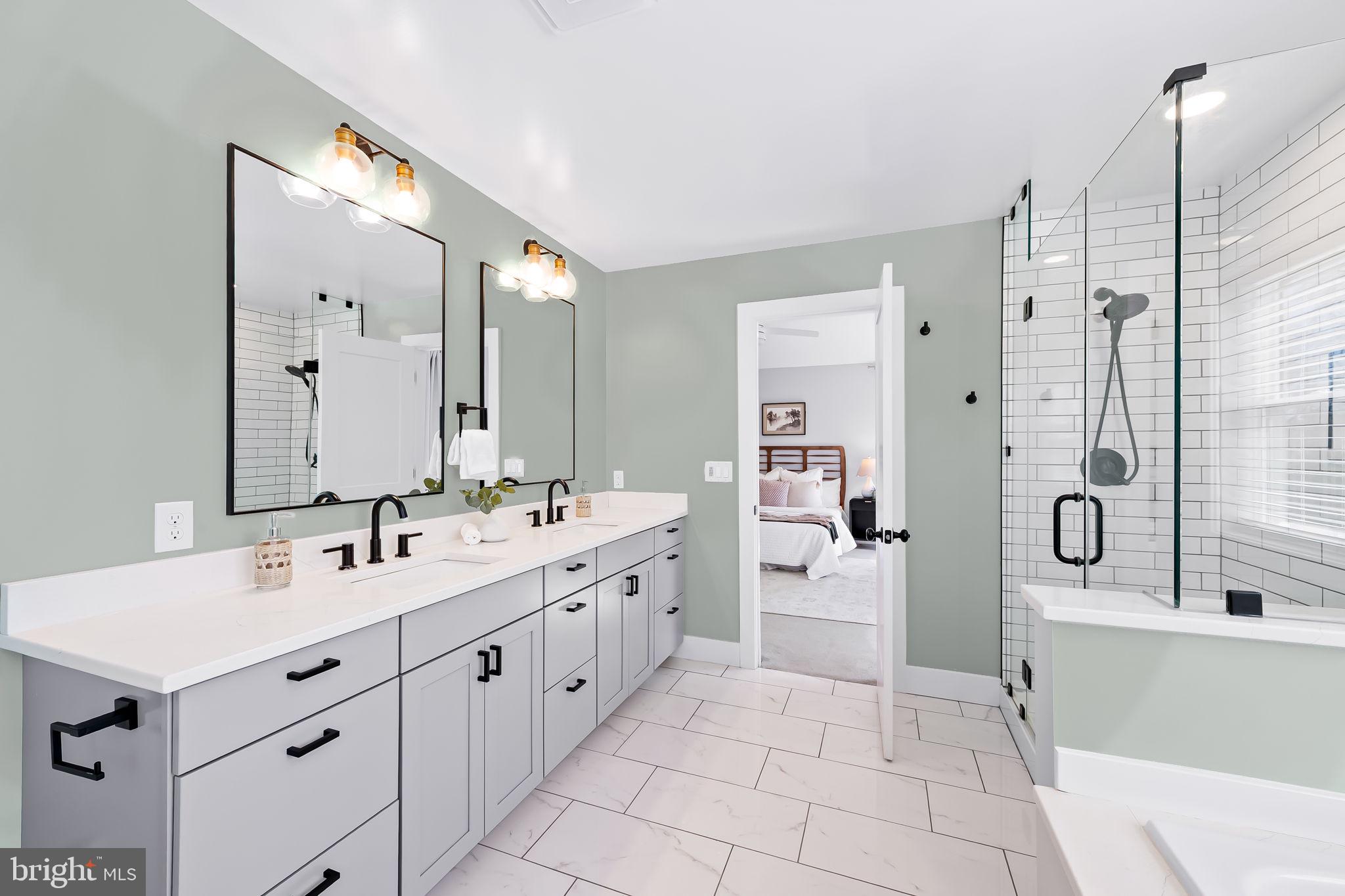 7321 Chesapeake Road Baltimore, MD 21220 - Photo 30 of 60 a spacious bathroom with a double vanity sink mirror bathtub and shower