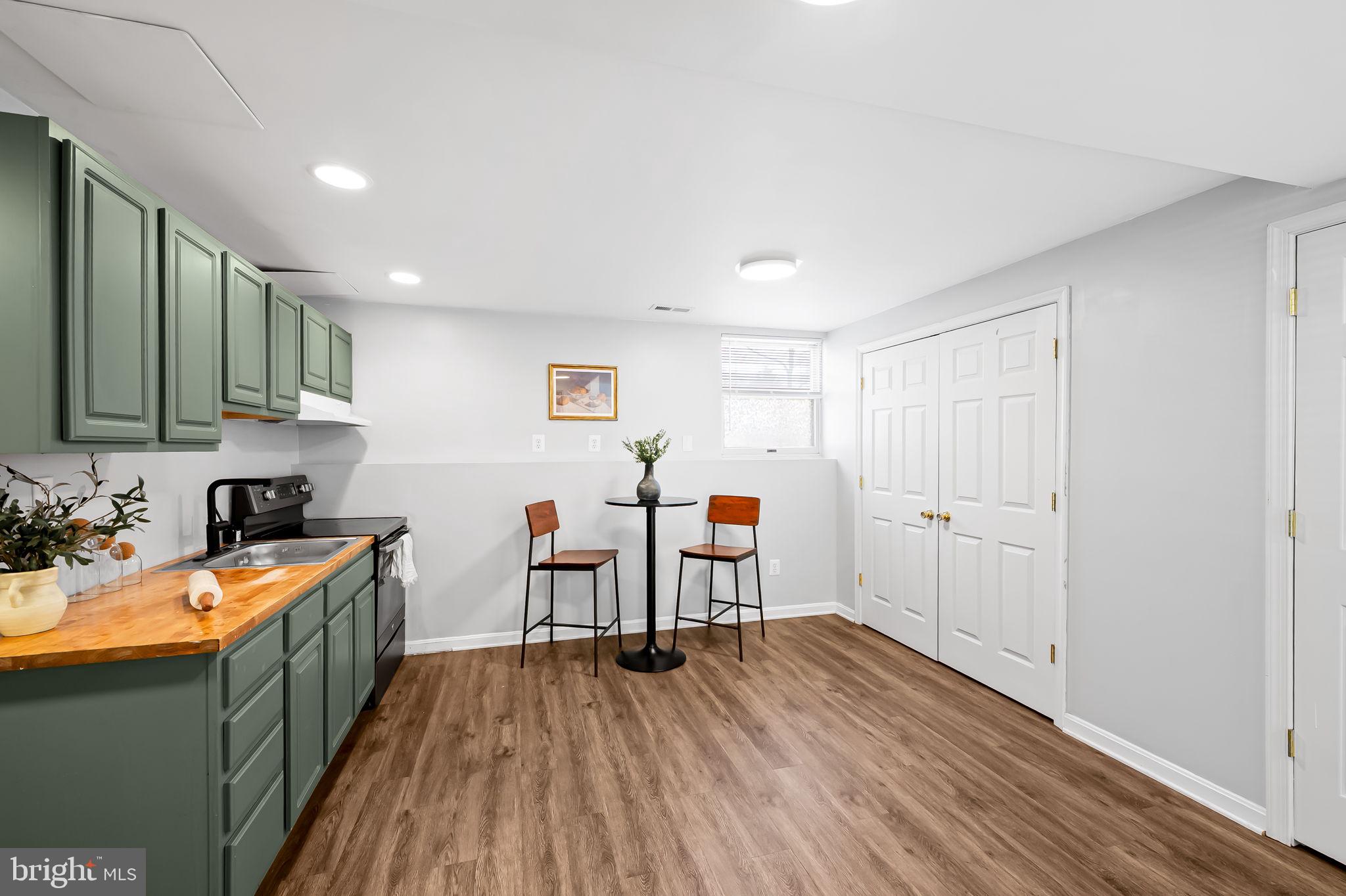 7321 Chesapeake Road Baltimore, MD 21220 - Photo 39 of 60 a view of a kitchen with sink and wooden floor