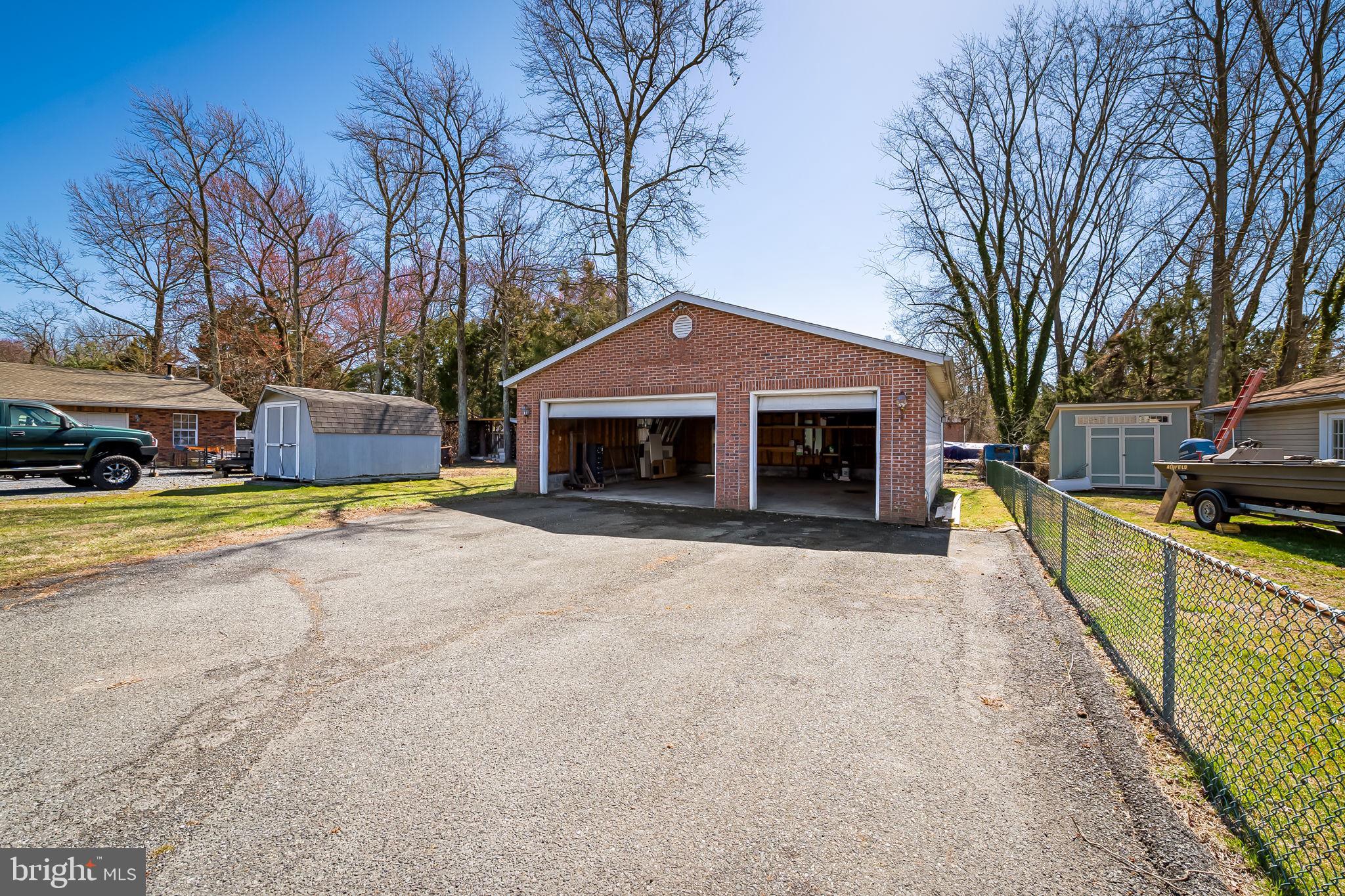 7321 Chesapeake Road Baltimore, MD 21220 - Photo 44 of 60 a view of a house with a yard and large tree