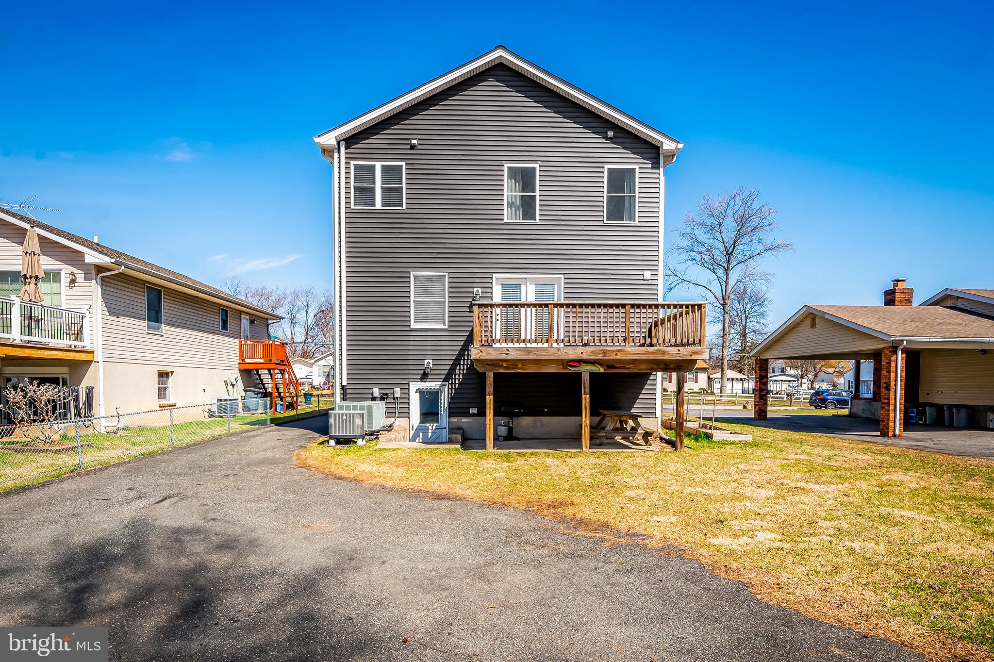 7321 Chesapeake Road Baltimore, MD 21220 - Photo 46 of 60 a view of a house with a yard and sitting area