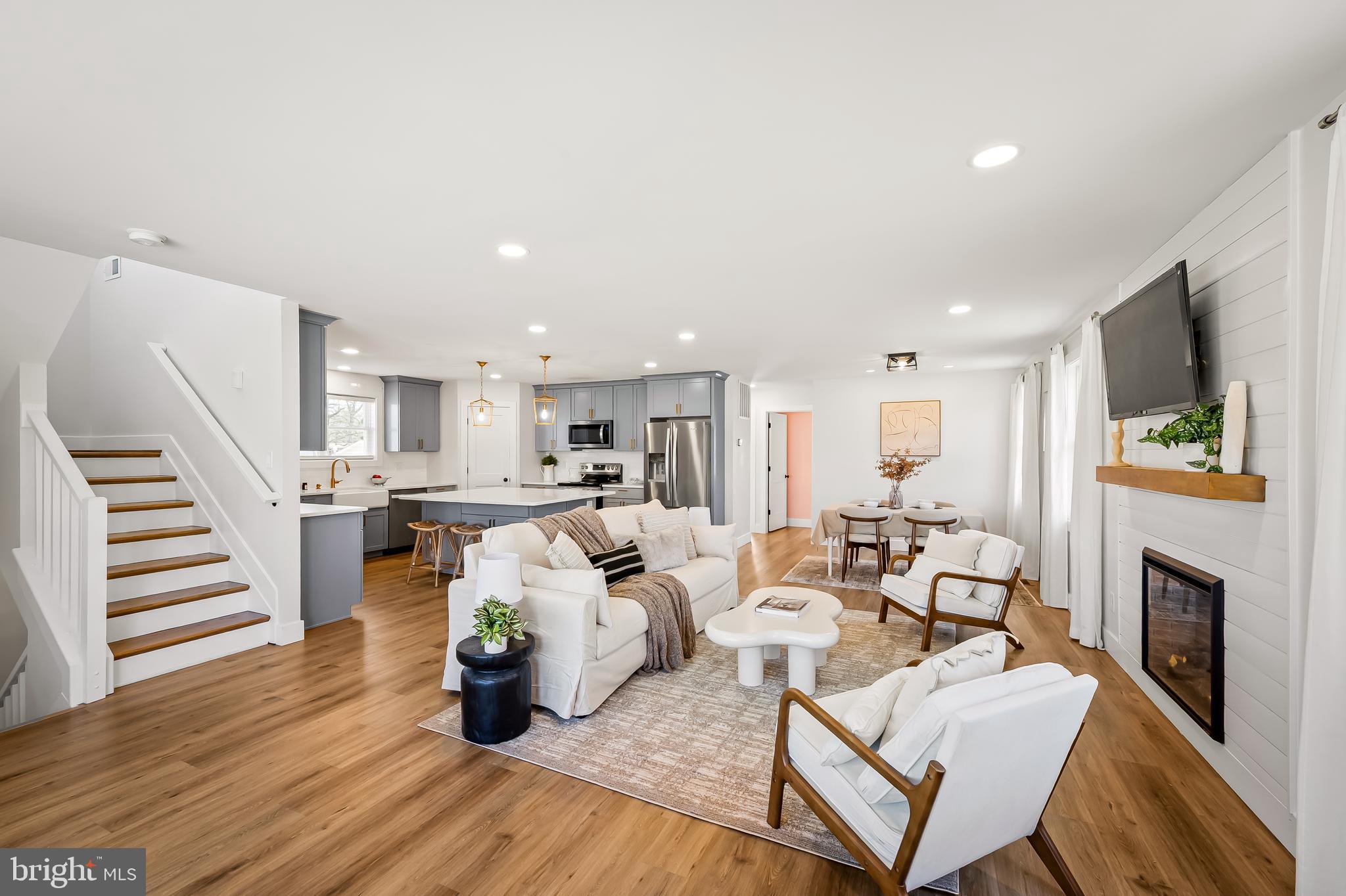 7321 Chesapeake Road Baltimore, MD 21220 - Photo 5 of 60 a living room with fireplace furniture and a wooden floor