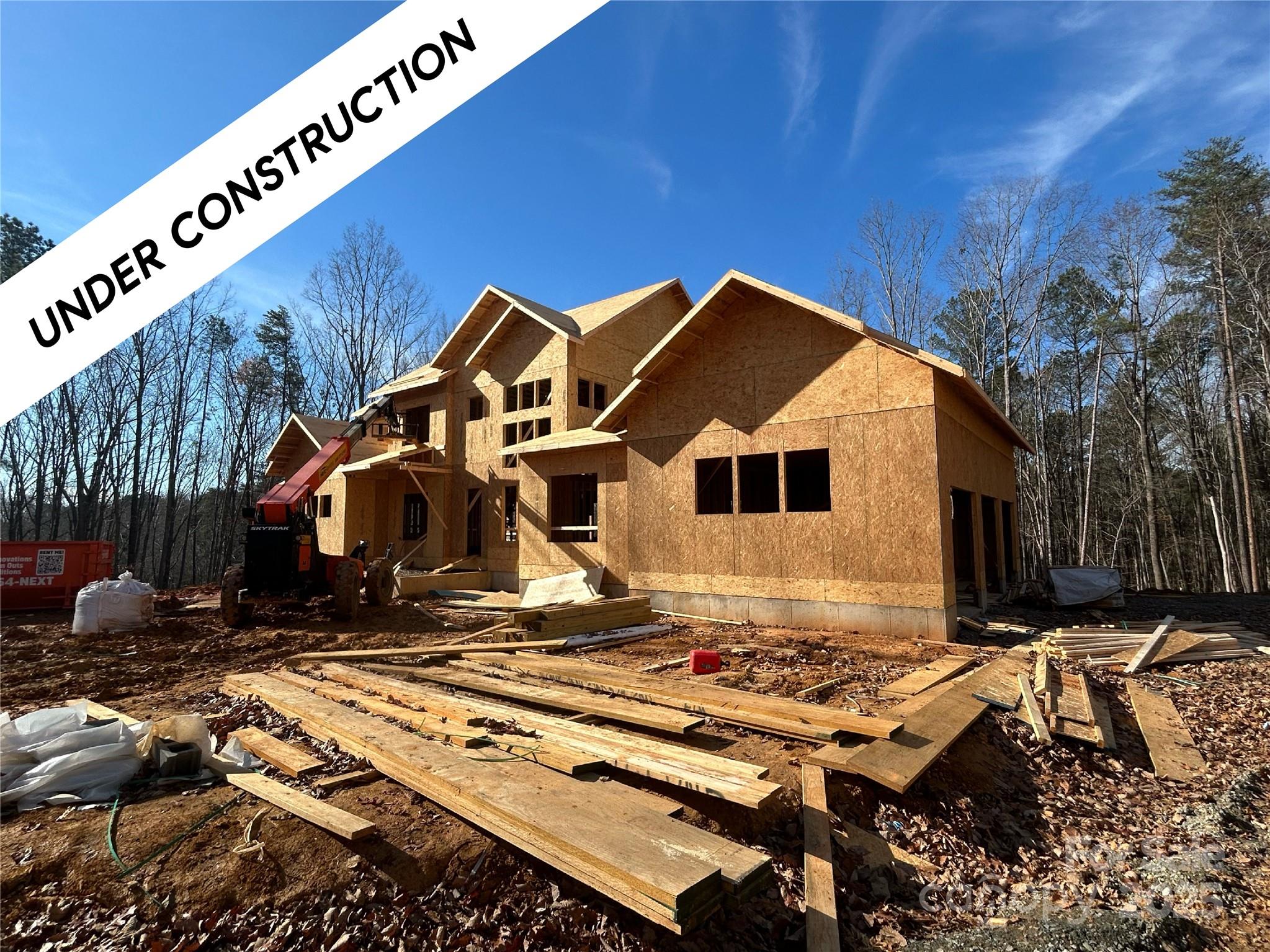 9215 Island Point Road Charlotte, NC 28278 - Photo 2 of 8 a front view of a house with a yard