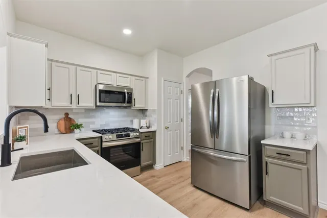 a living room with furniture a fireplace and a window
