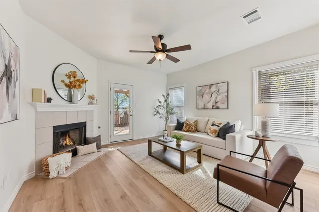 a spacious bathroom with a granite countertop sink a toilet and a mirror