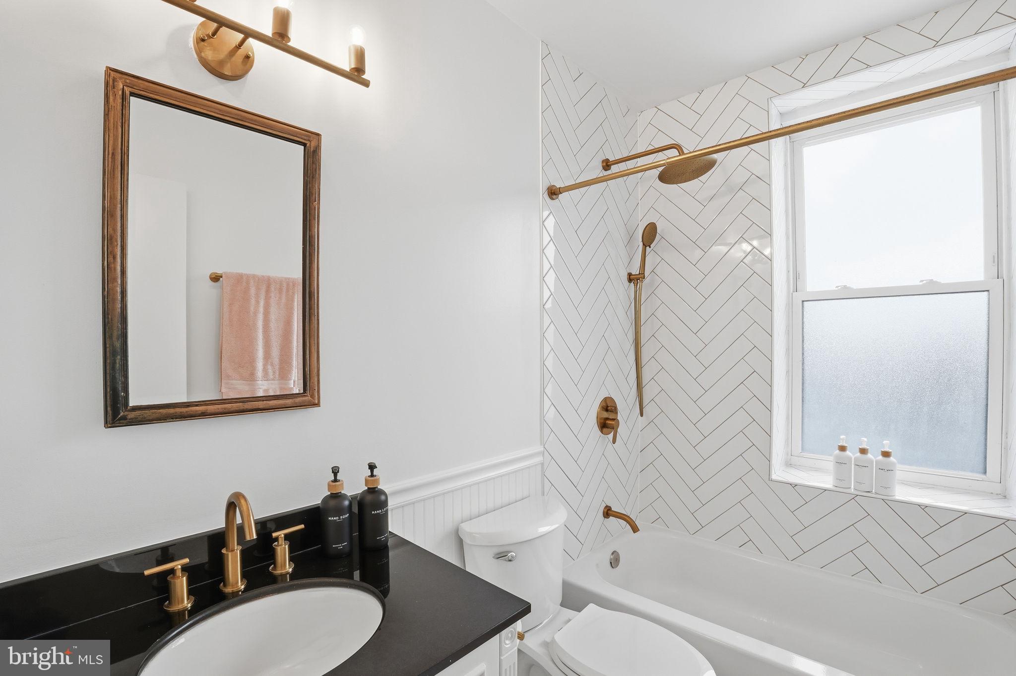 2001 16th Street Northwest, Unit 202 Washington, DC 20009 - Photo 12 of 20 a bathroom with a sink a toilet and shower