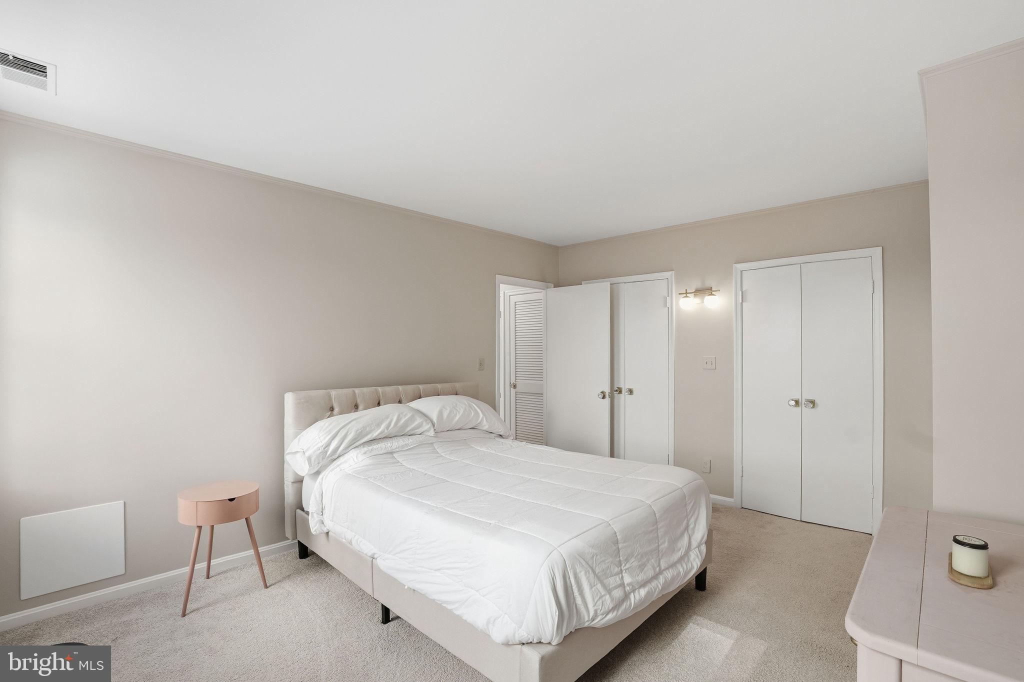 2001 16th Street Northwest, Unit 202 Washington, DC 20009 - Photo 13 of 20 a bedroom with a bed and a lamp