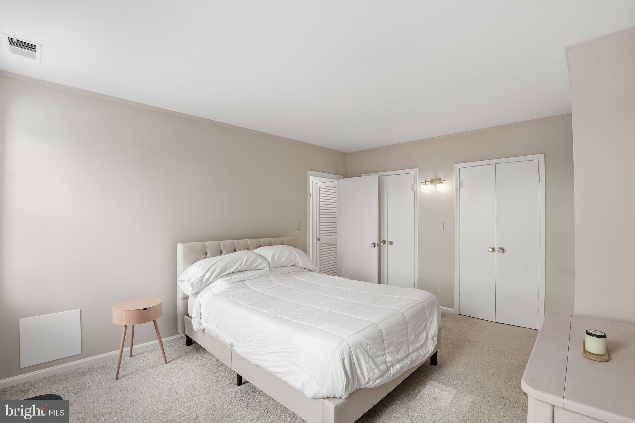 2001 16th Street Northwest, Unit 202 Washington, DC 20009 - Photo 15 of 20 a bedroom with a bed and a lamp