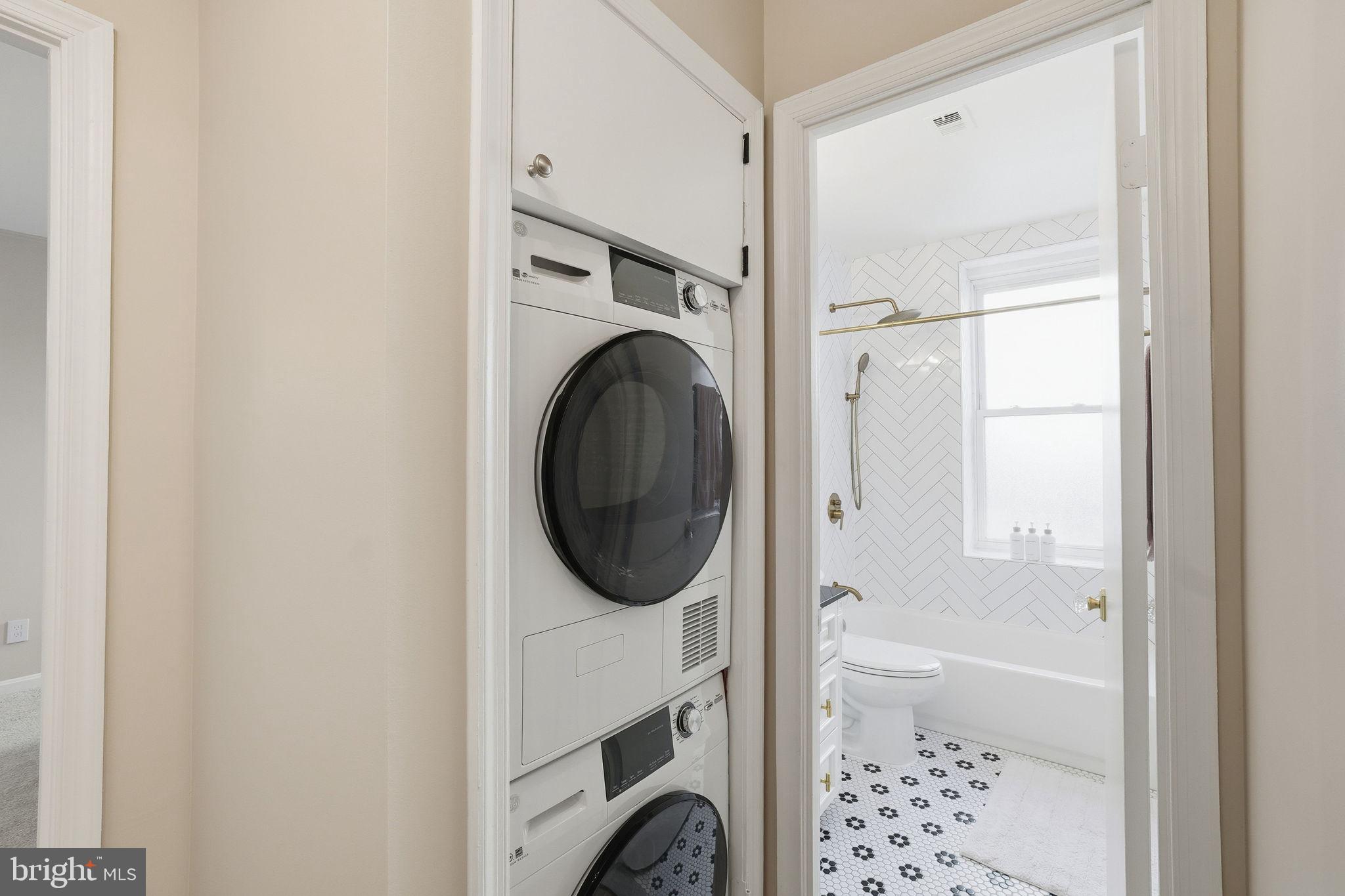 2001 16th Street Northwest, Unit 202 Washington, DC 20009 - Photo 10 of 20 a room with a washer and dryer