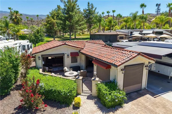 a aerial view of a house with garden and plants