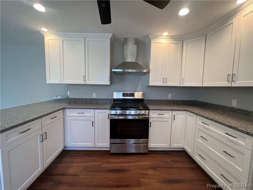 183 Farrier's Road White Stone, VA 22578 - Photo 13 of 19 Kitchen featuring wall chimney exhaust hood, dark wood-type flooring, gas stove, and white cabinetry