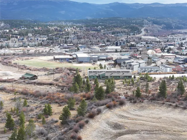 a view of an ocean beach and mountain