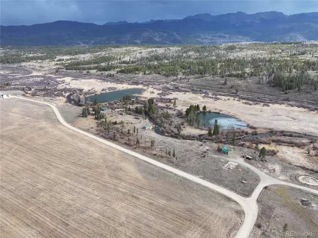 a view of a yard with a mountain