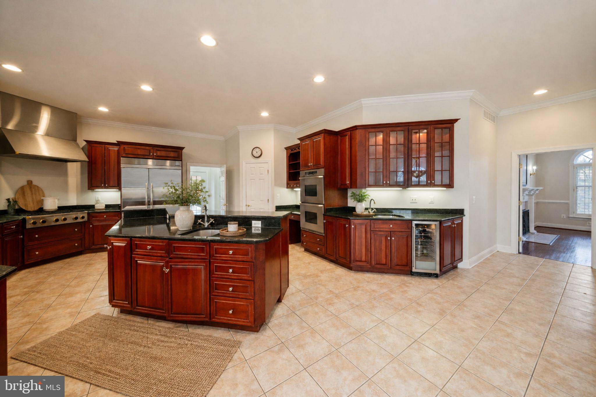 505 Pond View Lane Hunt Valley, MD 21030 - Photo 11 of 104 a kitchen with stainless steel appliances granite countertop a stove a sink and a refrigerator