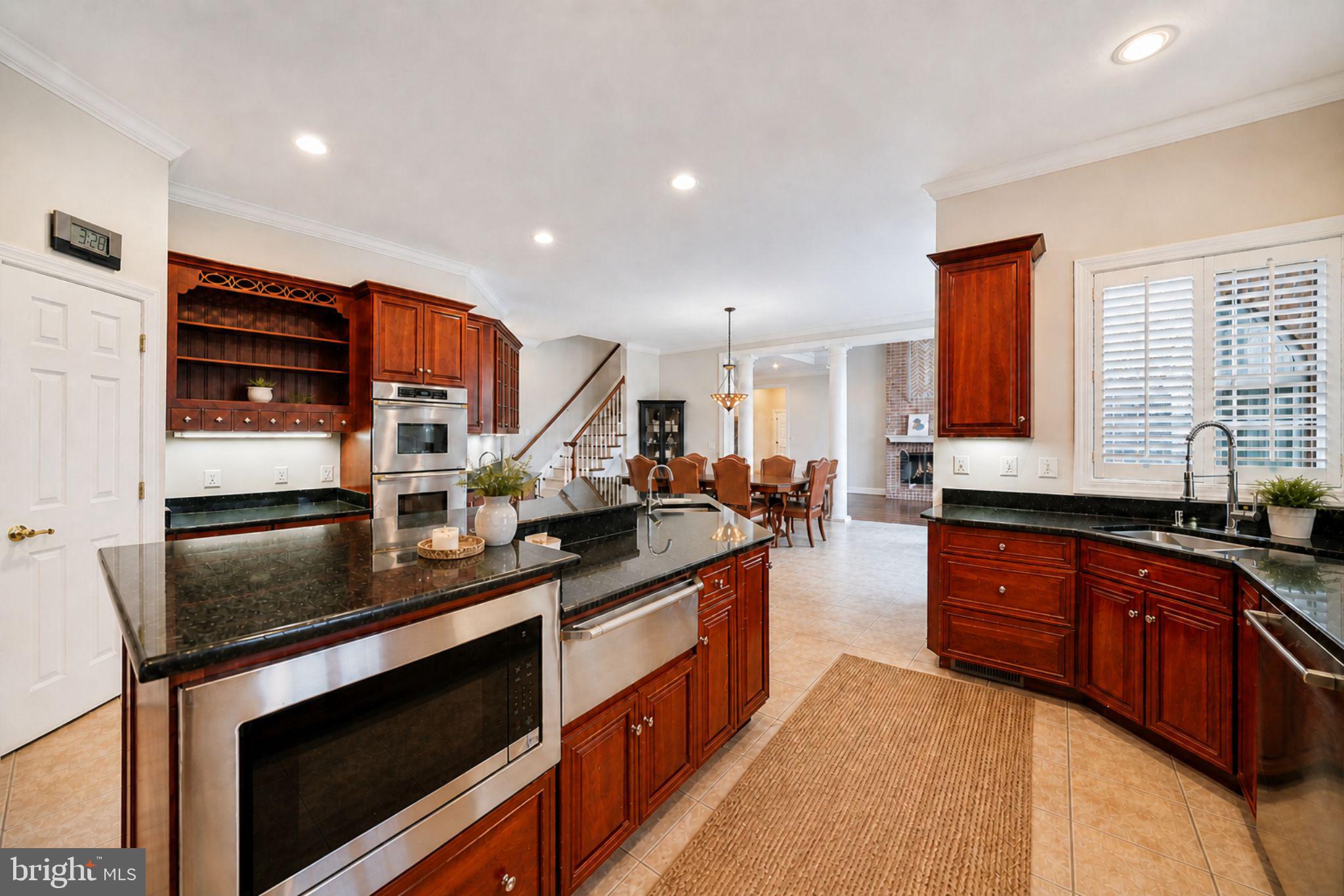 505 Pond View Lane Hunt Valley, MD 21030 - Photo 14 of 104 a kitchen with stainless steel appliances granite countertop a stove a sink and a refrigerator