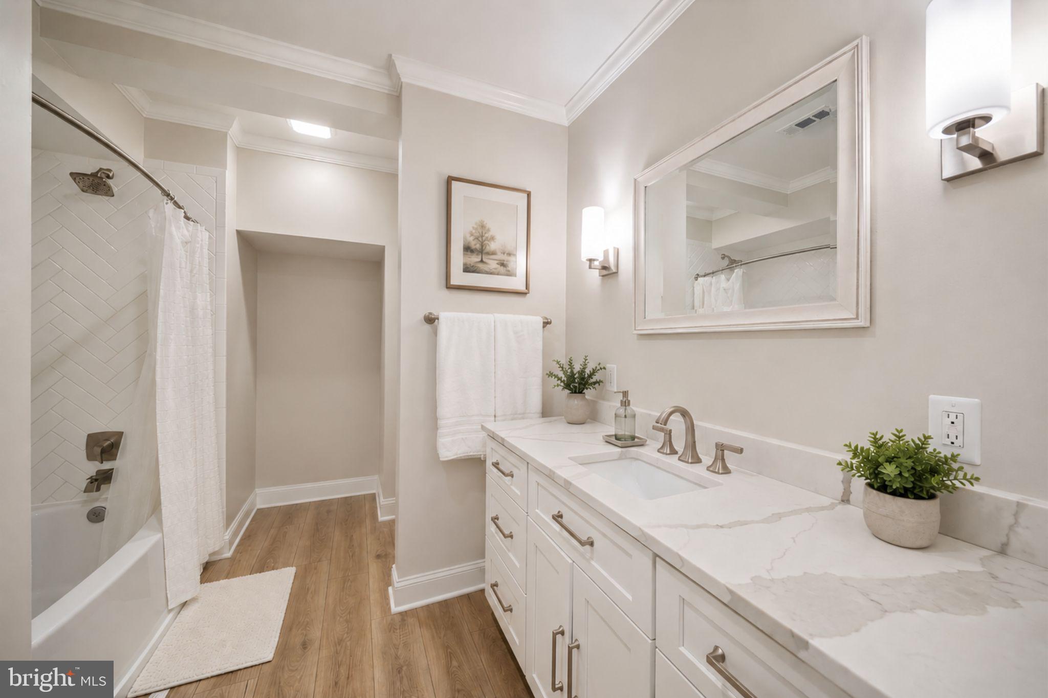 505 Pond View Lane Hunt Valley, MD 21030 - Photo 44 of 104 a bathroom with a double vanity sink a large mirror a shower and a bathtub