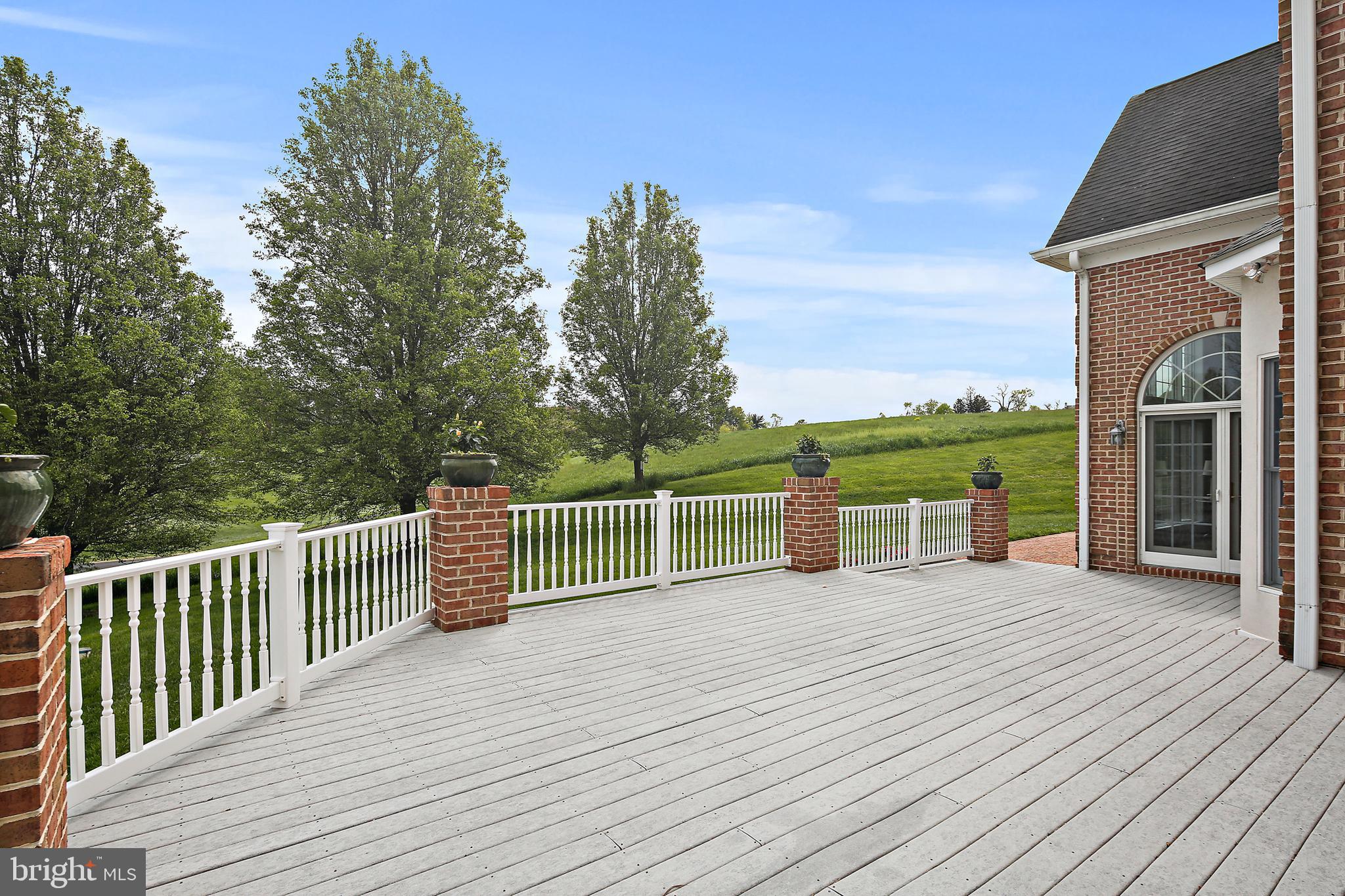 505 Pond View Lane Hunt Valley, MD 21030 - Photo 47 of 104 a view of a deck with wooden floor and fence with a large garden