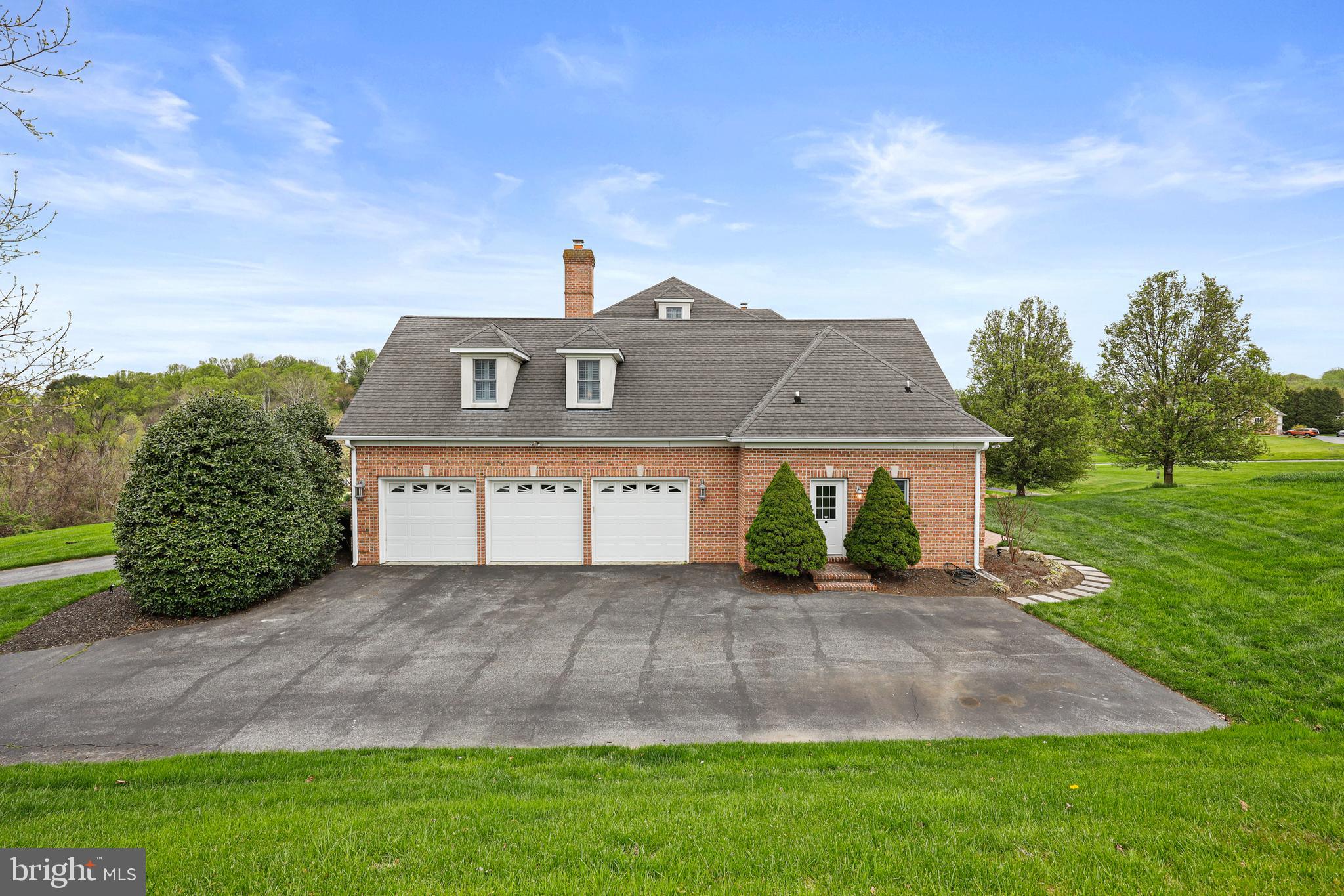 505 Pond View Lane Hunt Valley, MD 21030 - Photo 52 of 104 a front view of a house with a yard and garage