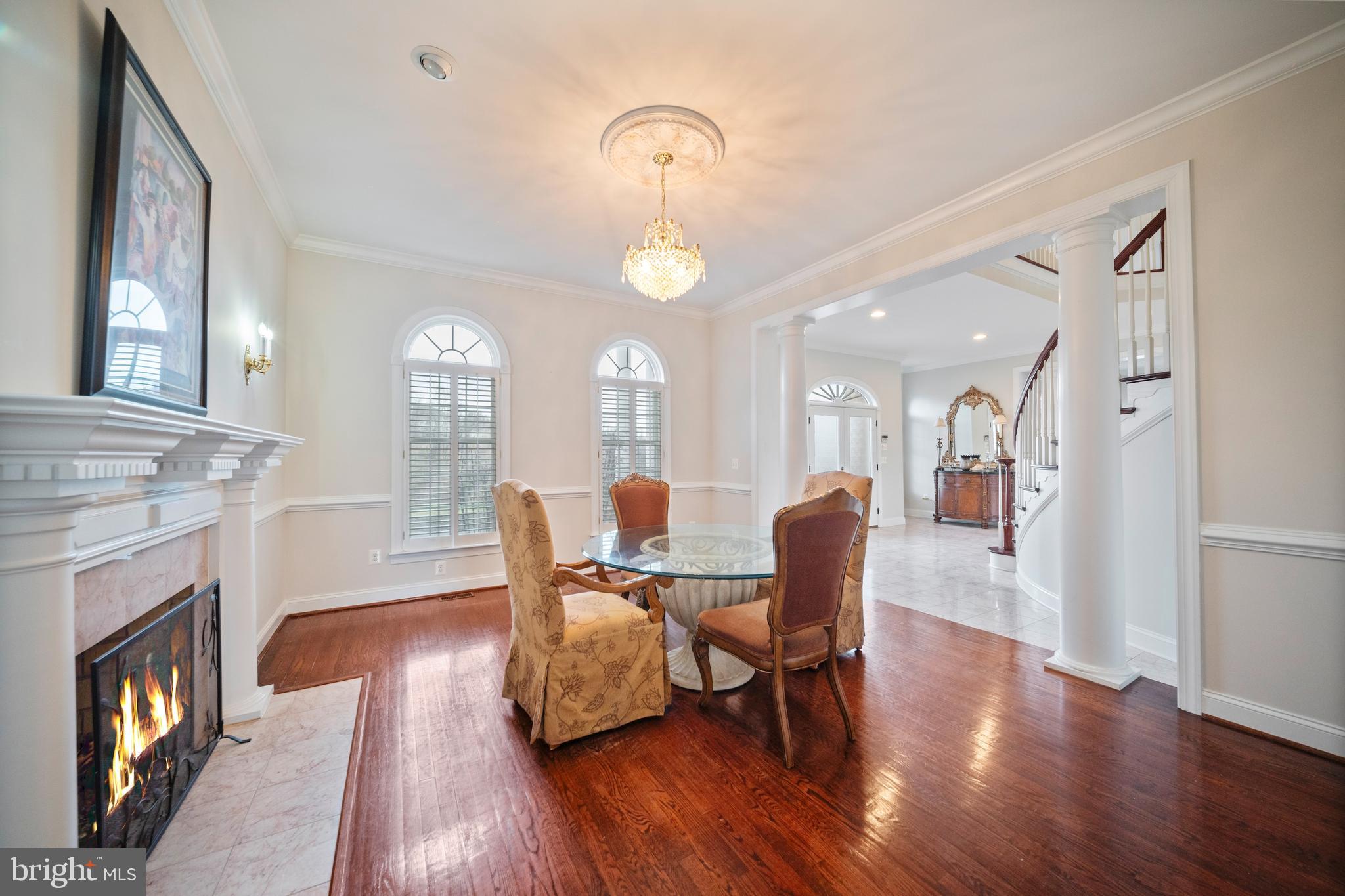 505 Pond View Lane Hunt Valley, MD 21030 - Photo 60 of 104 a dining room with wooden floor a chandelier a wooden table and chairs