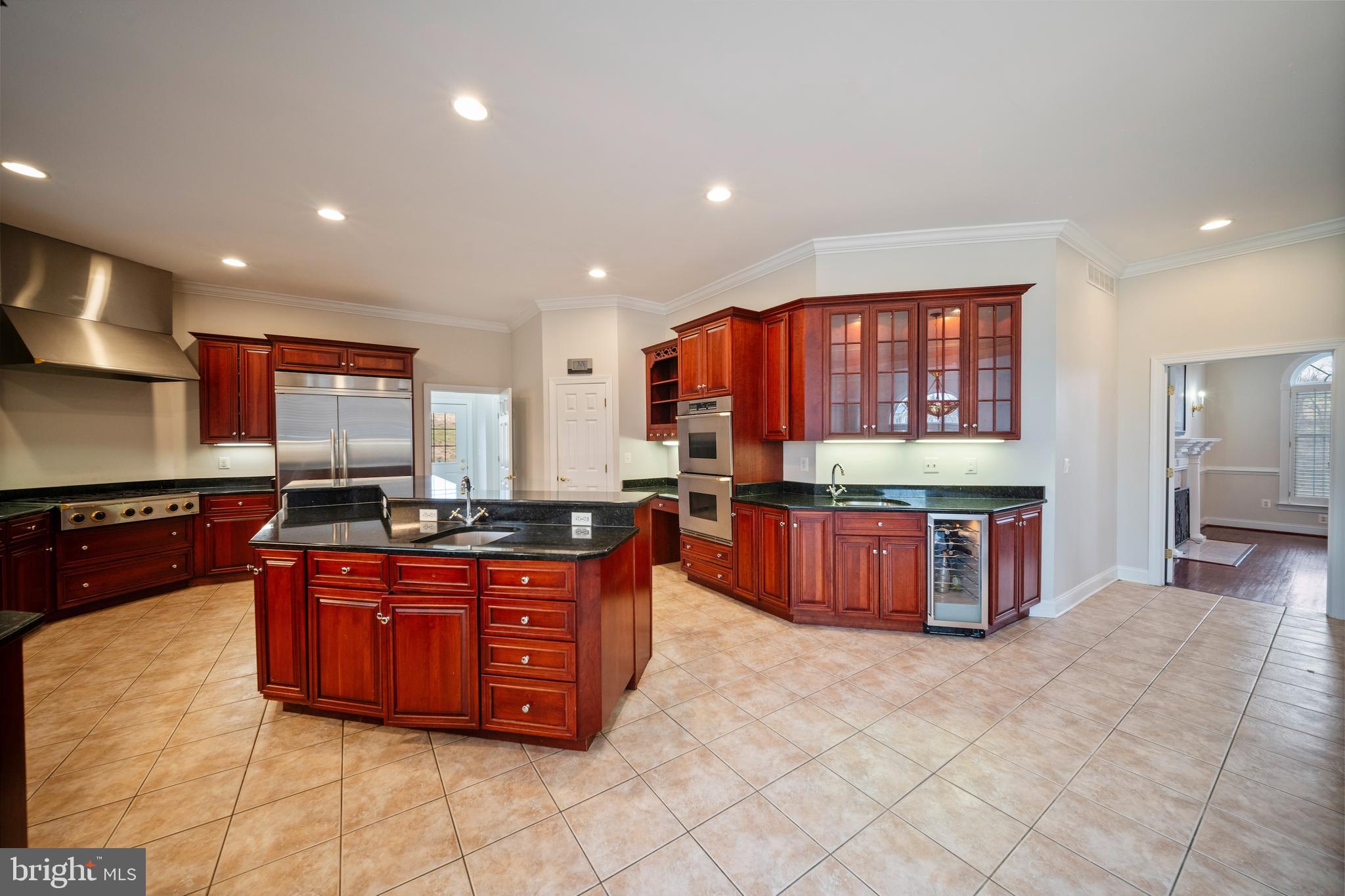 505 Pond View Lane Hunt Valley, MD 21030 - Photo 68 of 104 a kitchen with stainless steel appliances granite countertop a stove a sink and a refrigerator