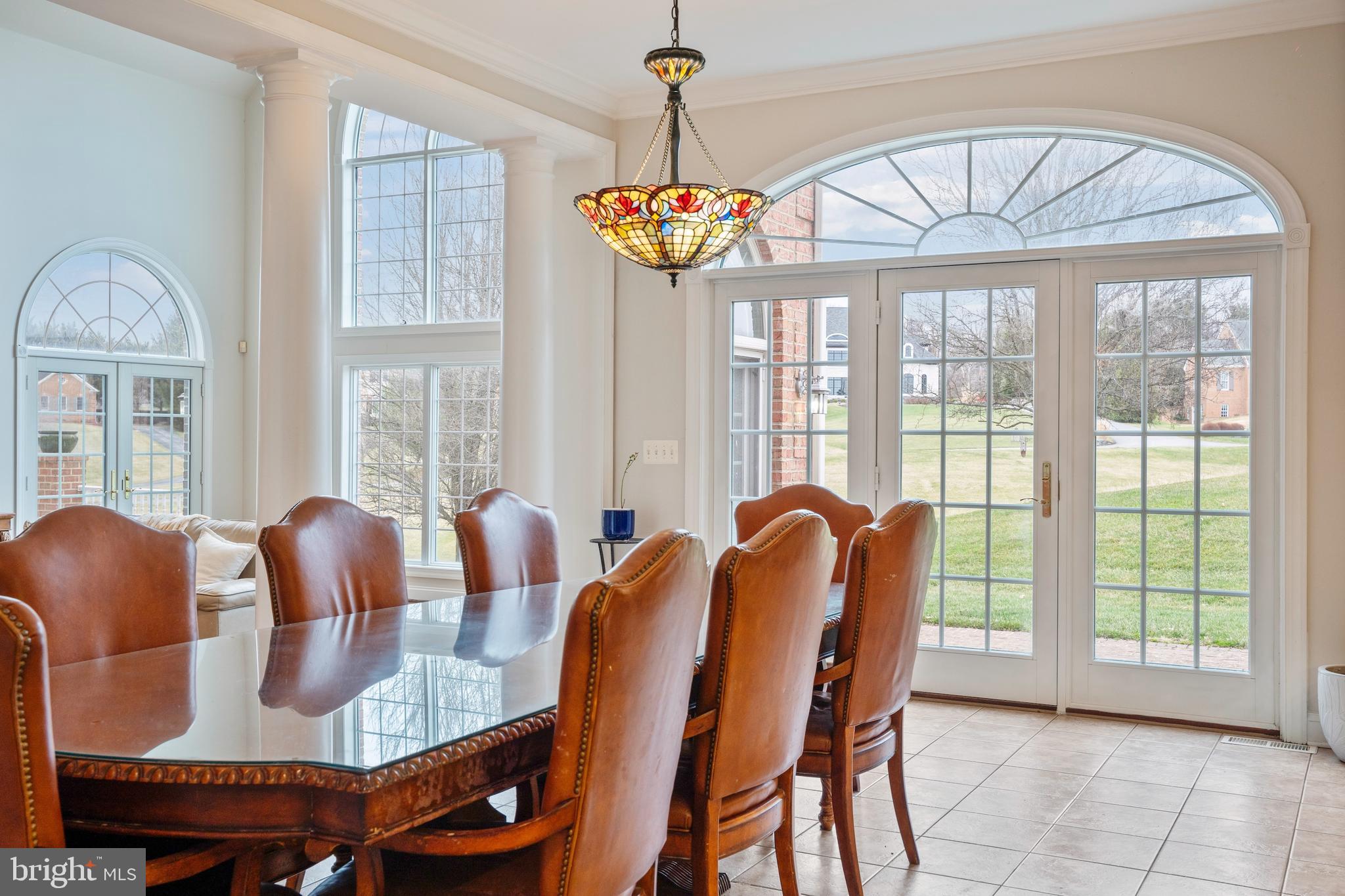 505 Pond View Lane Hunt Valley, MD 21030 - Photo 77 of 104 a dining room with furniture a chandelier and wooden floor