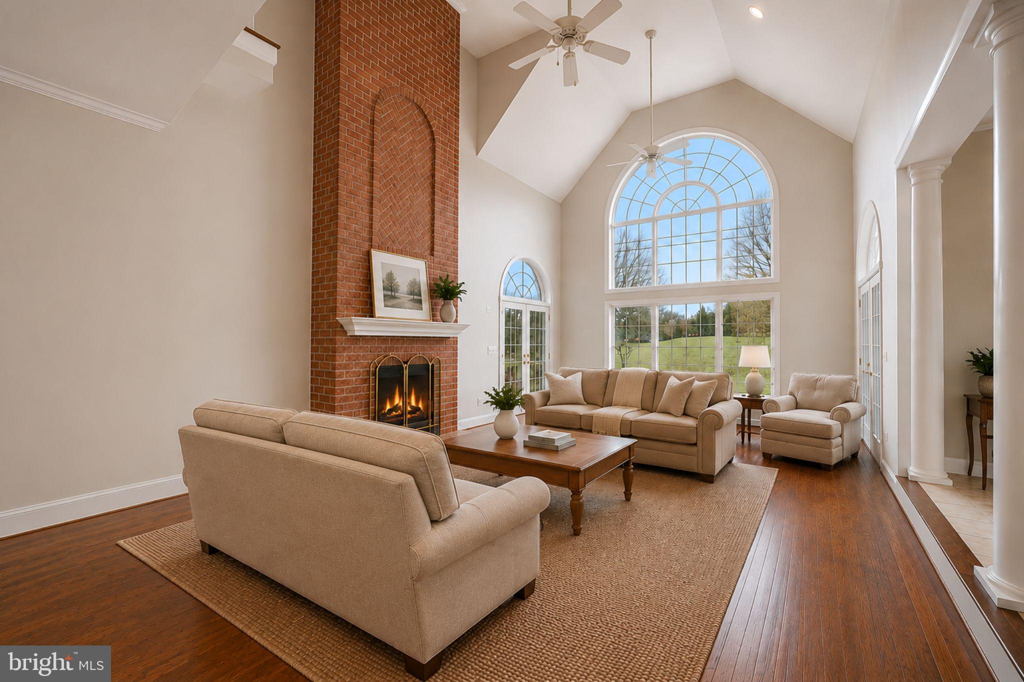 505 Pond View Lane Hunt Valley, MD 21030 - Photo 10 of 104 a living room with fireplace furniture and a large window