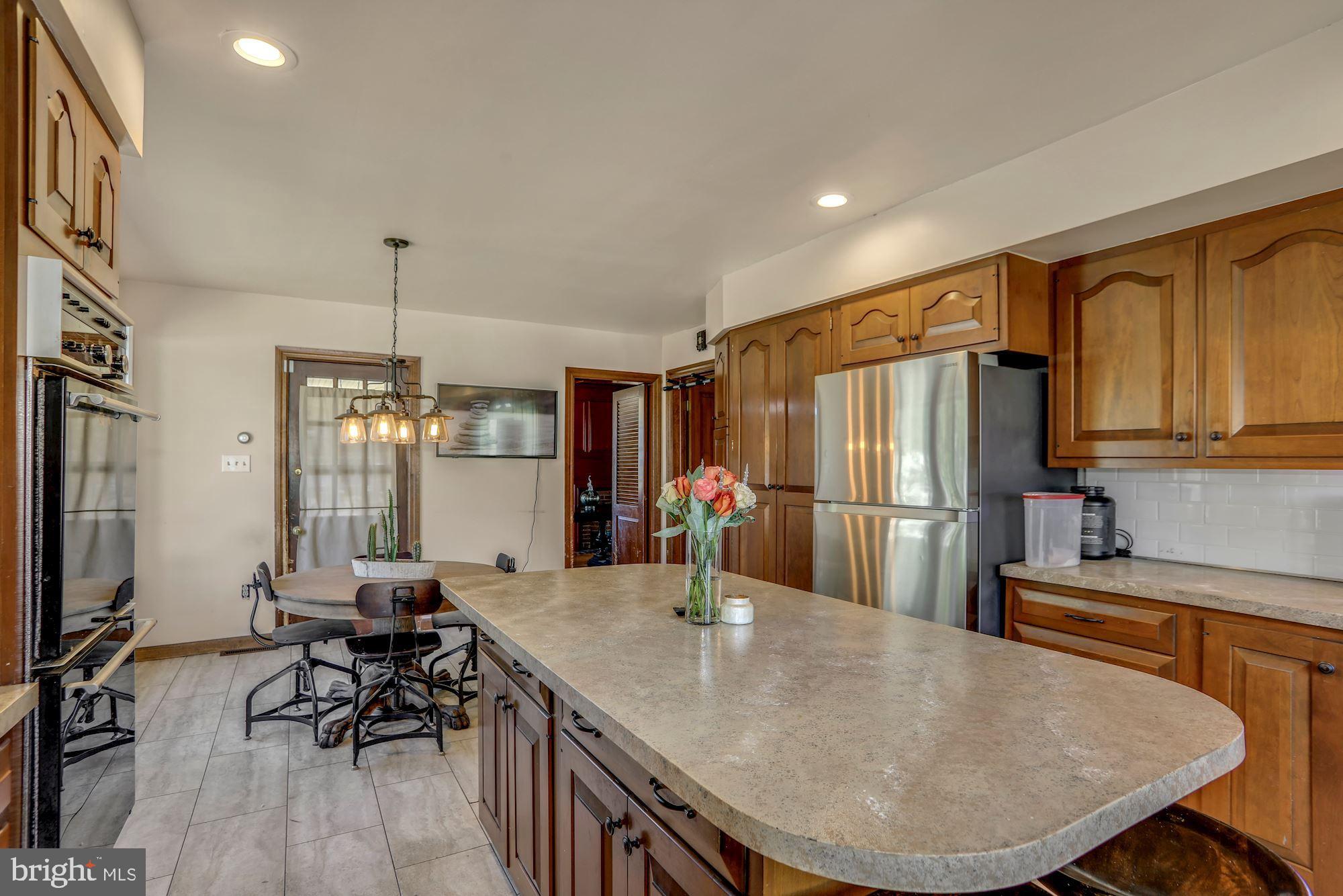 138 Pitman Avenue Pitman, NJ 08071 - Photo 11 of 32 a kitchen with stainless steel appliances granite countertop a sink a stove and refrigerator