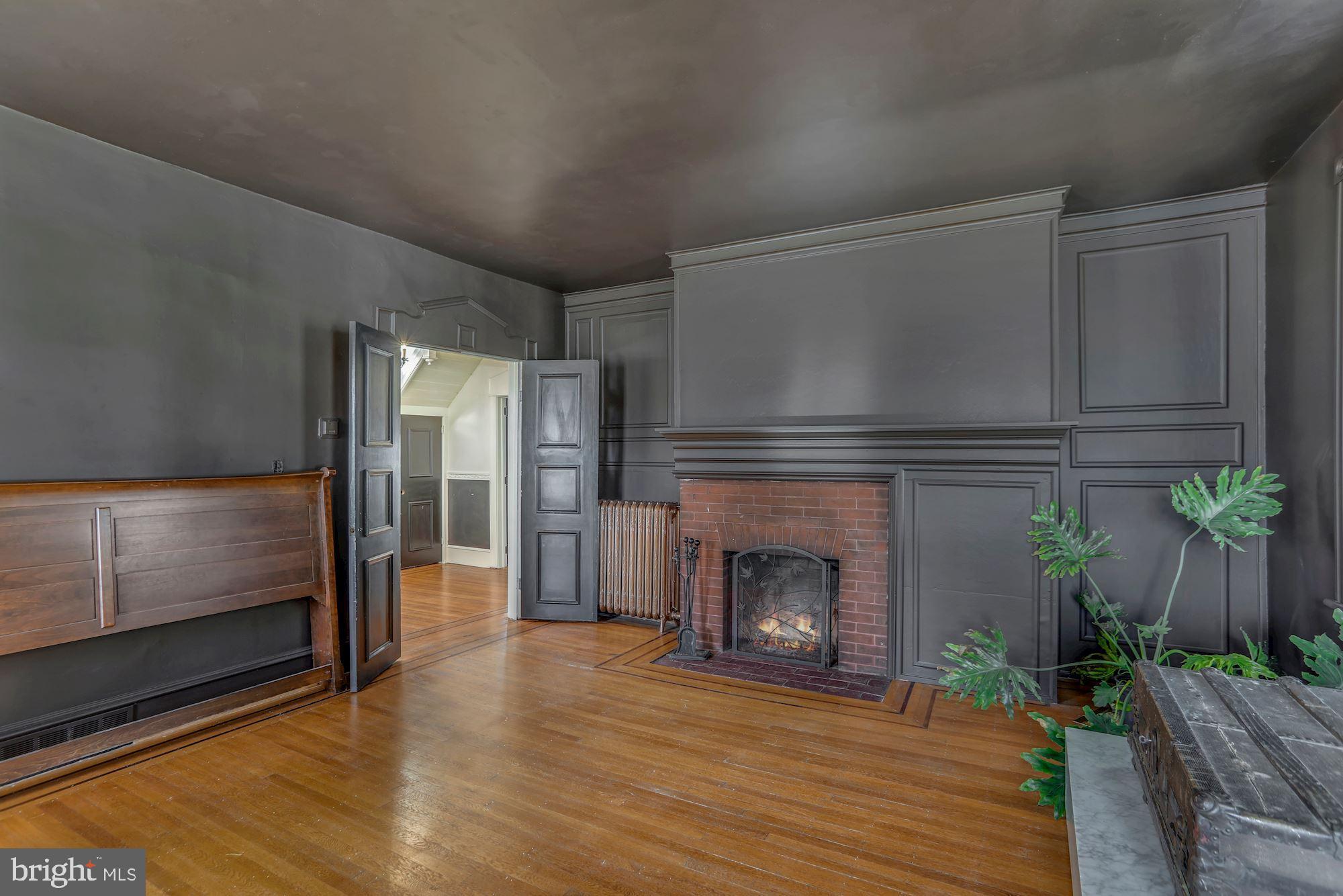 138 Pitman Avenue Pitman, NJ 08071 - Photo 15 of 32 a living room with furniture and a fireplace