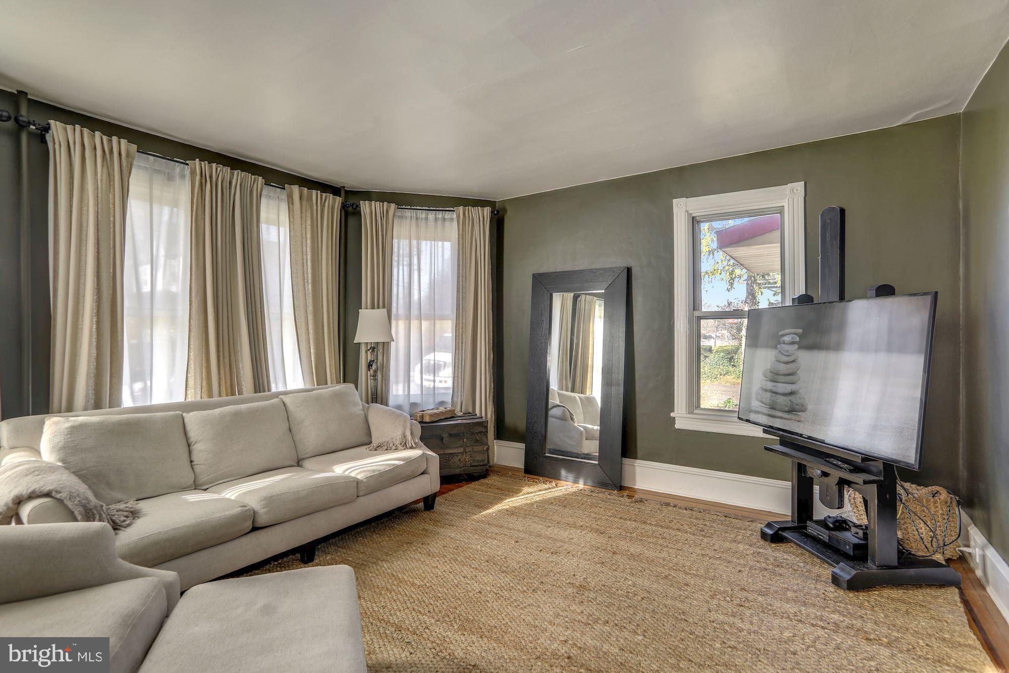 138 Pitman Avenue Pitman, NJ 08071 - Photo 16 of 32 a living room with furniture and a flat screen tv