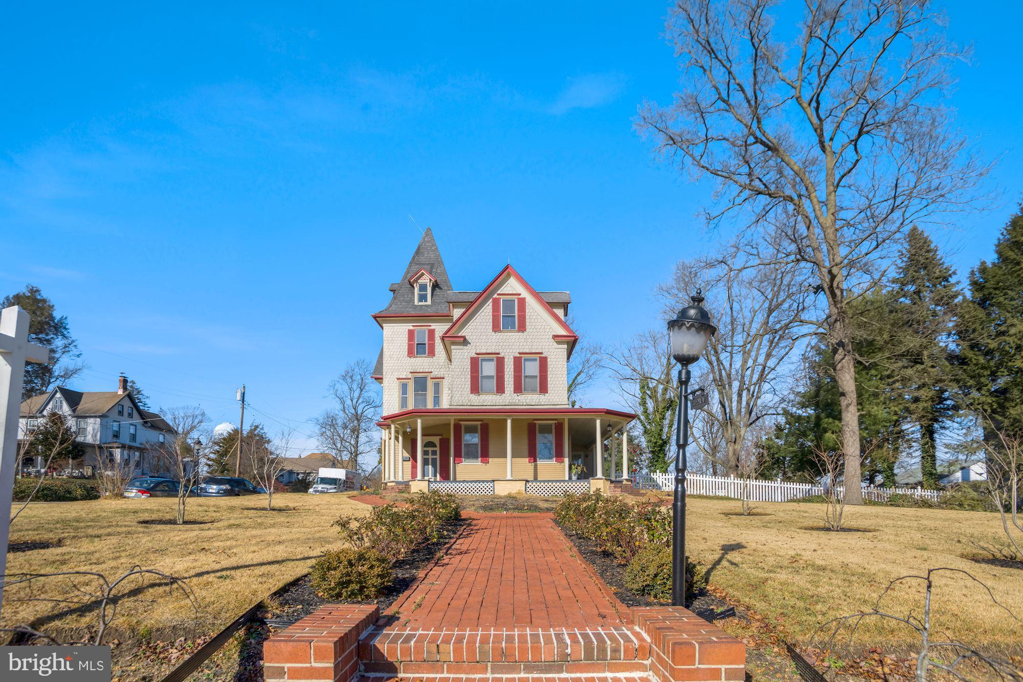138 Pitman Avenue Pitman, NJ 08071 - Photo 3 of 32 a front view of a house with a yard