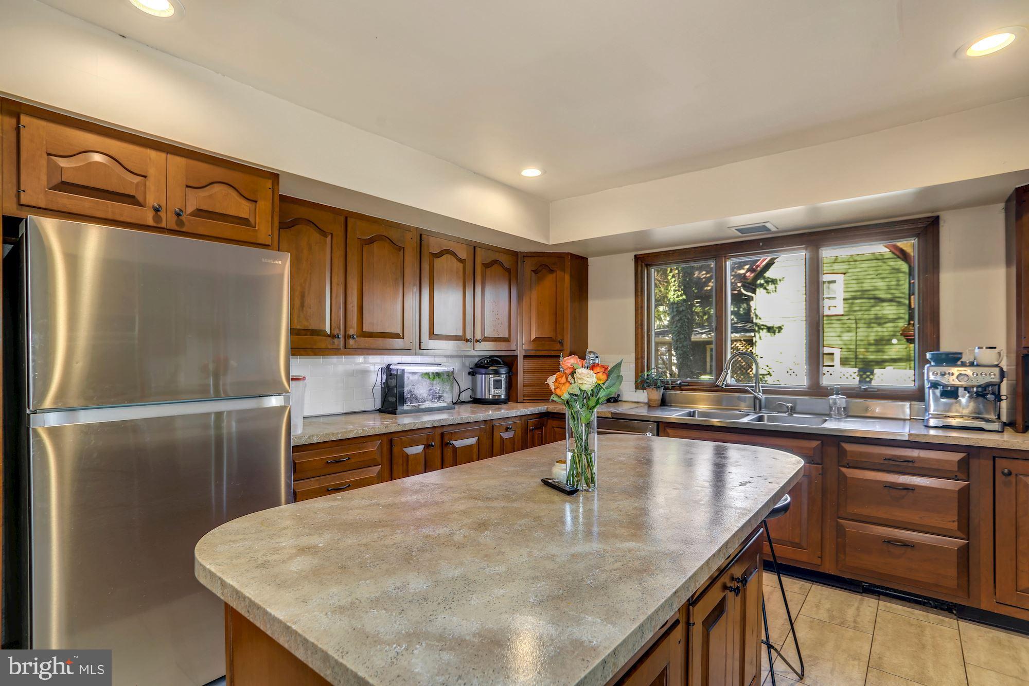138 Pitman Avenue Pitman, NJ 08071 - Photo 8 of 32 a kitchen with granite countertop a sink a counter top space and stainless steel appliances