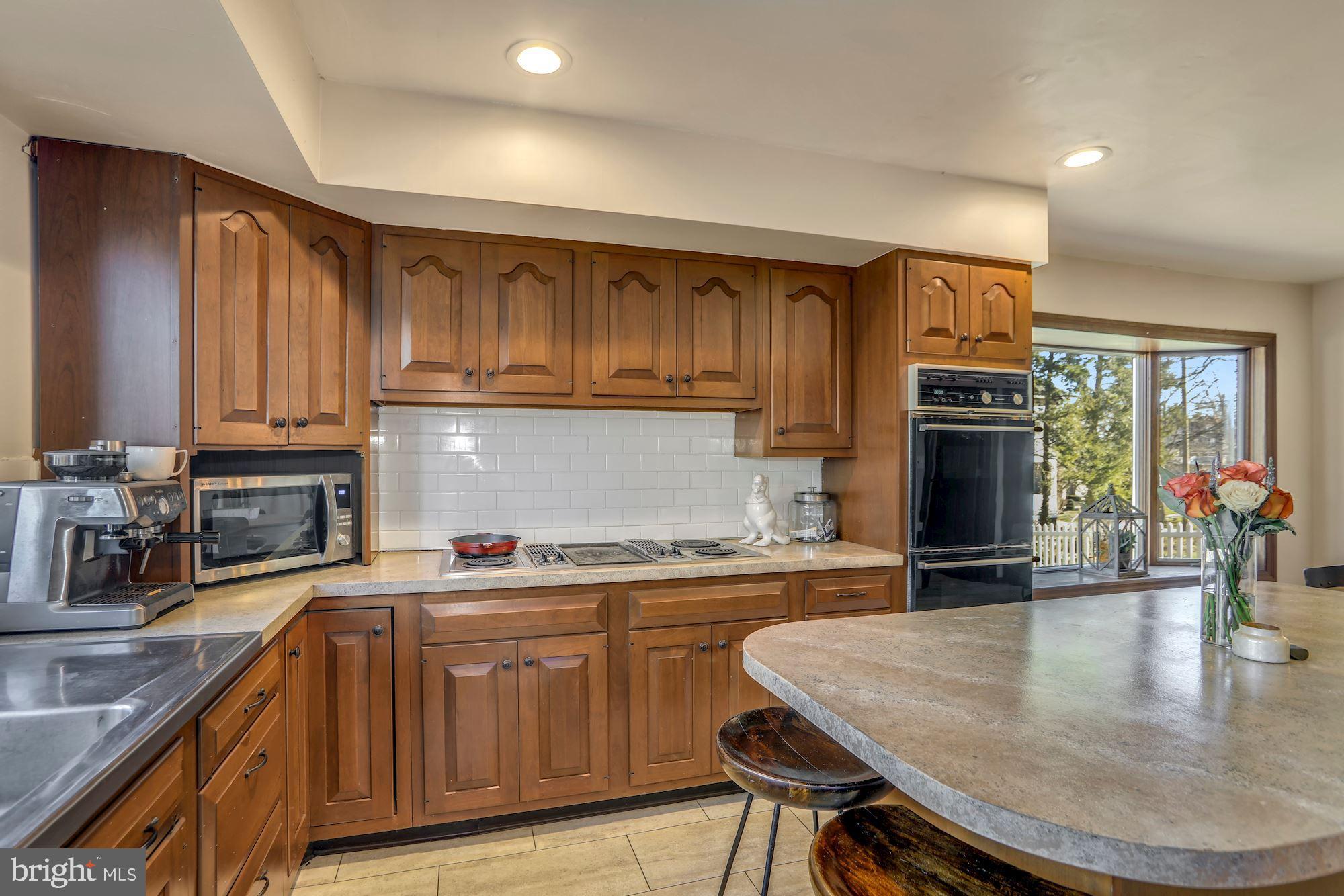 138 Pitman Avenue Pitman, NJ 08071 - Photo 10 of 32 a kitchen with stainless steel appliances granite countertop a sink a stove counter space and cabinets