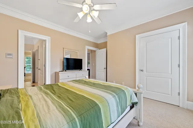 a kitchen with stainless steel appliances kitchen island granite countertop a refrigerator and cabinets