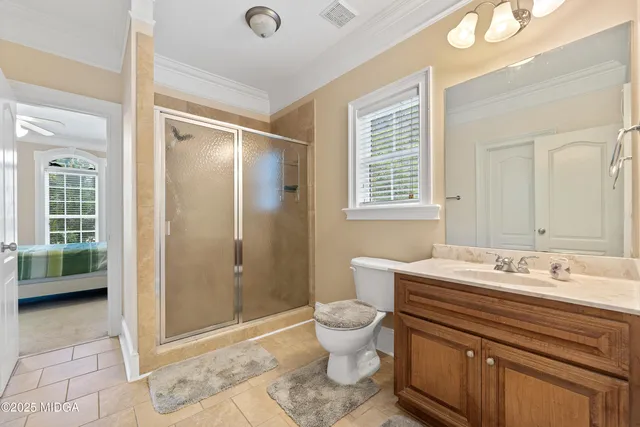 a large kitchen with stainless steel appliances granite countertop a large counter top a sink a stove a dining table and chairs