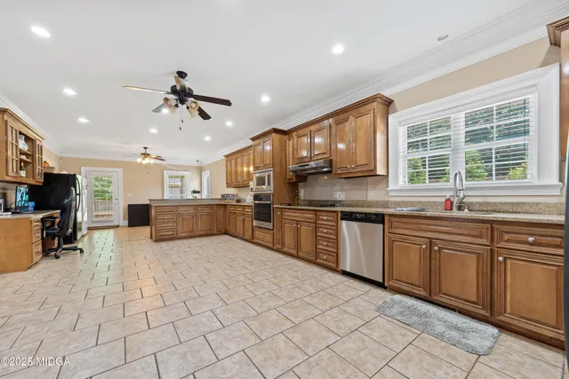 a living room with furniture a rug and a window